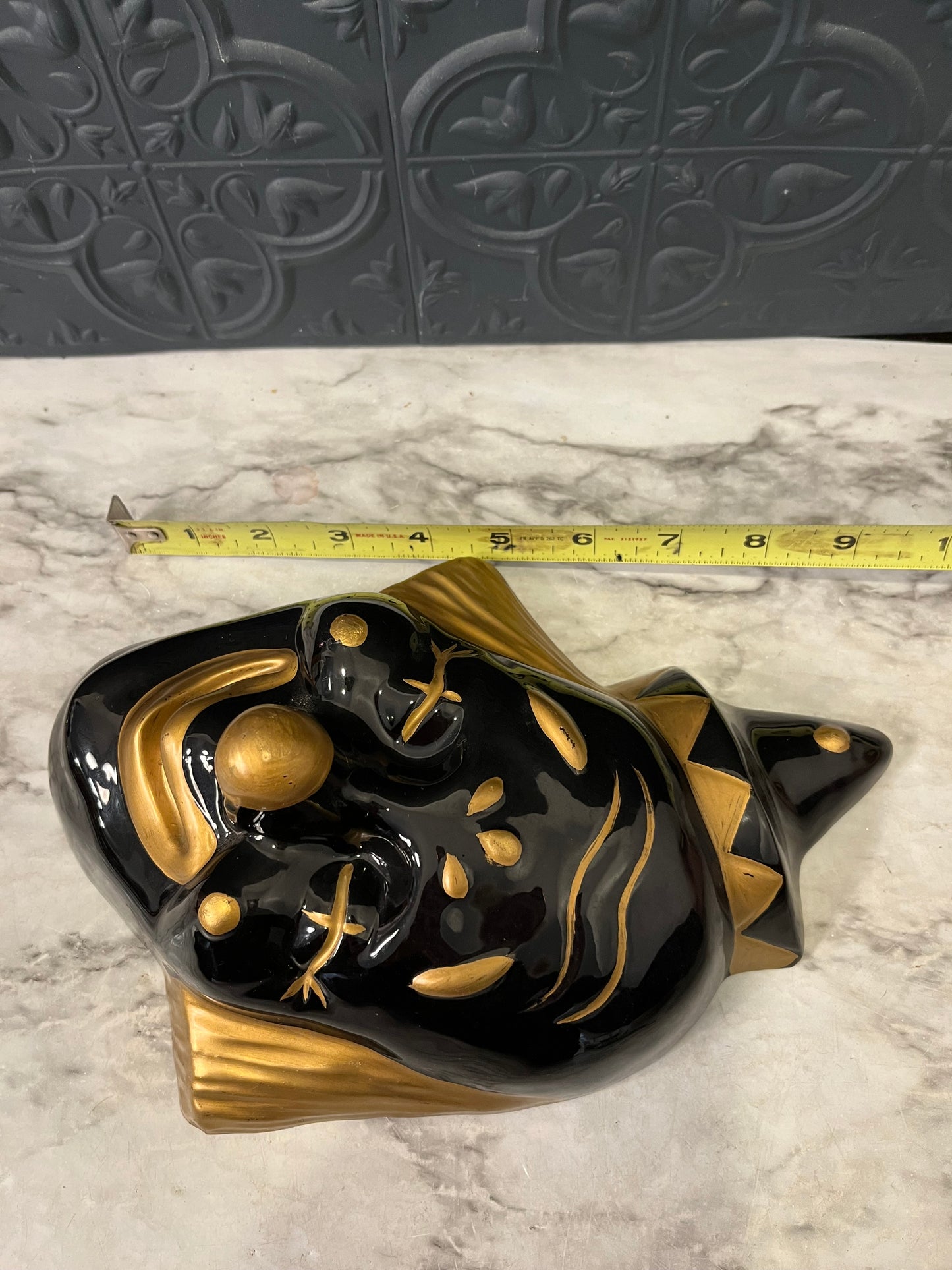 Gold and black Clown head