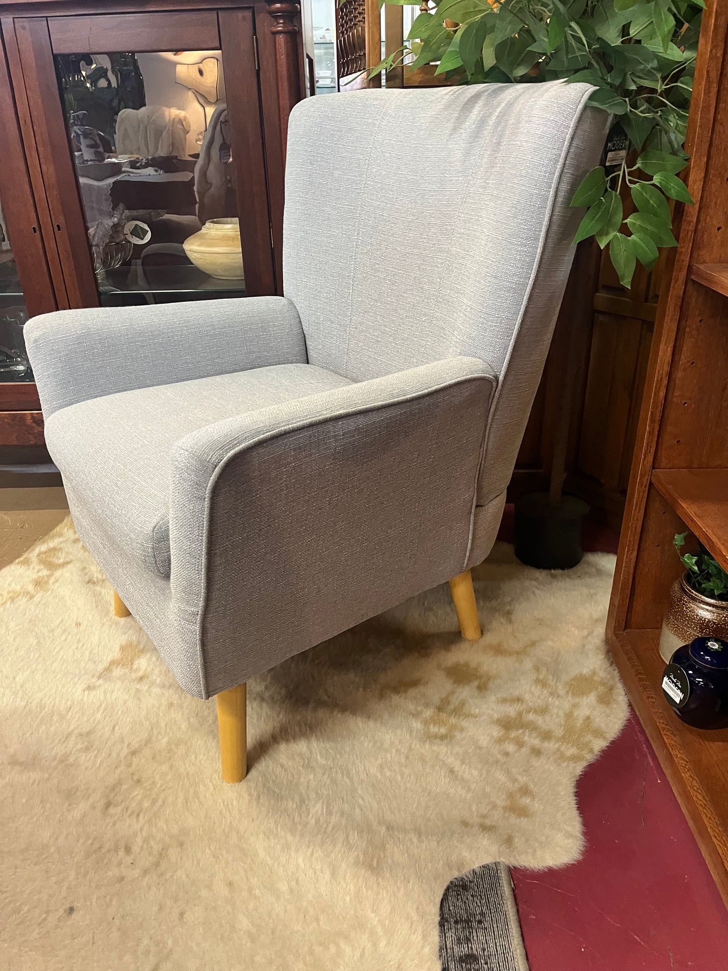 Gray arm chair with modern silhouette