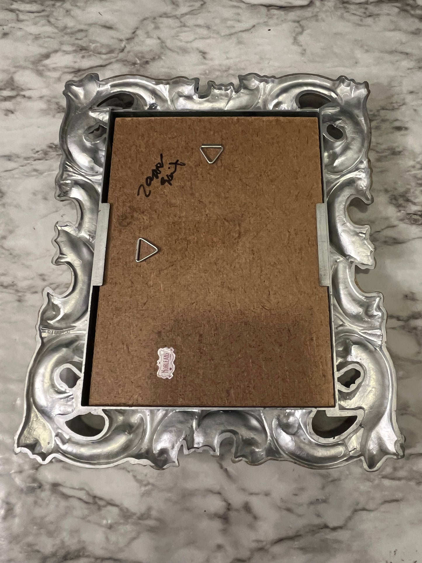 Ornate plastic frame with bridge print