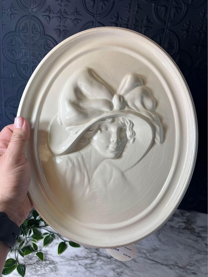 Plaster relief plaque of woman in hat
