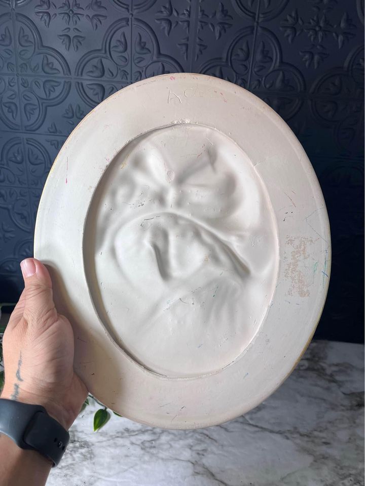 Plaster relief plaque of woman in hat