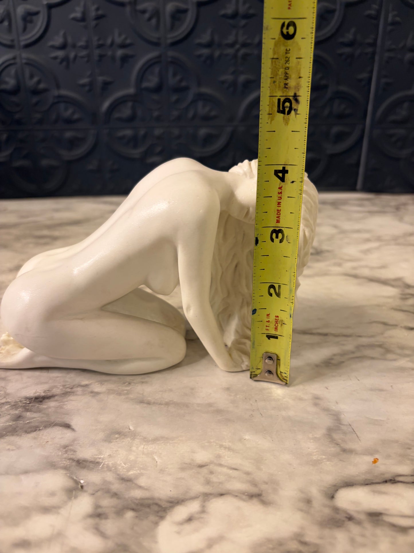 Nude Woman Bent over Statue