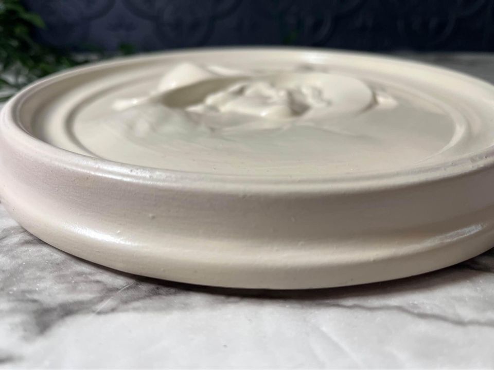 Plaster relief plaque of woman in hat