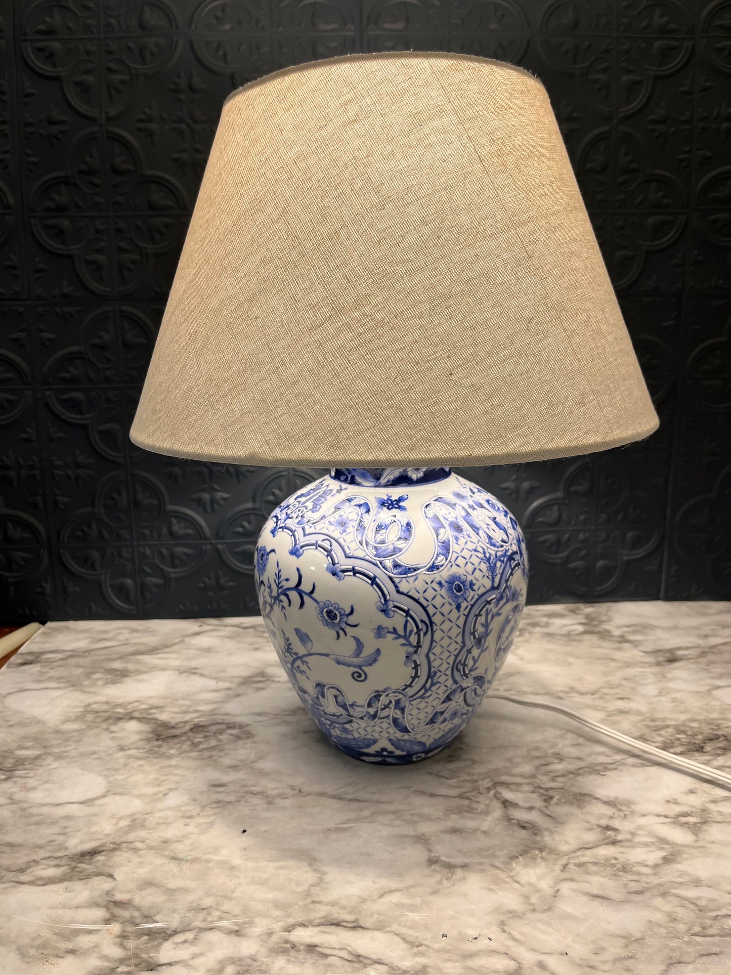 Blue and white table lamp with ribbon