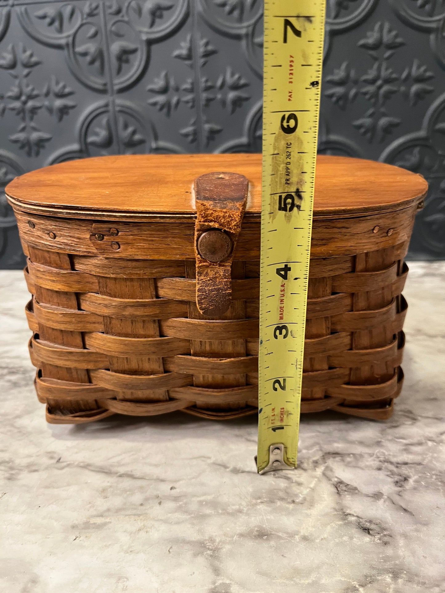 Small woven basket with lid and handle