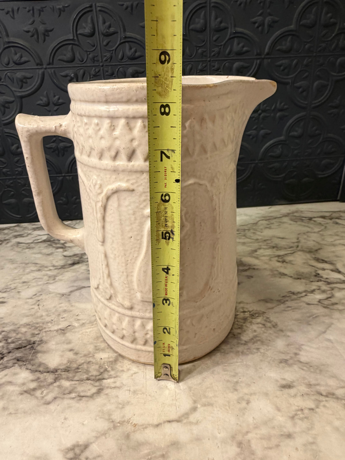 1920's Stoneware Pitcher with Relief RRP Co