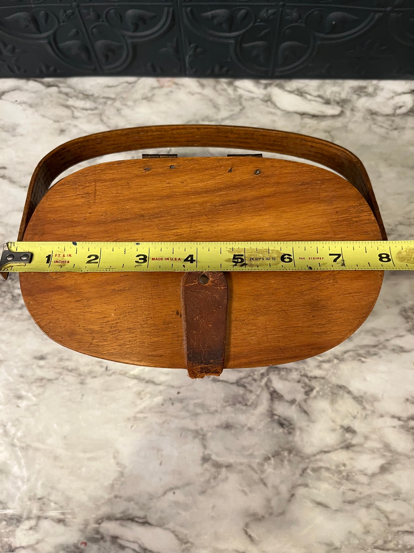 Small woven basket with lid and handle