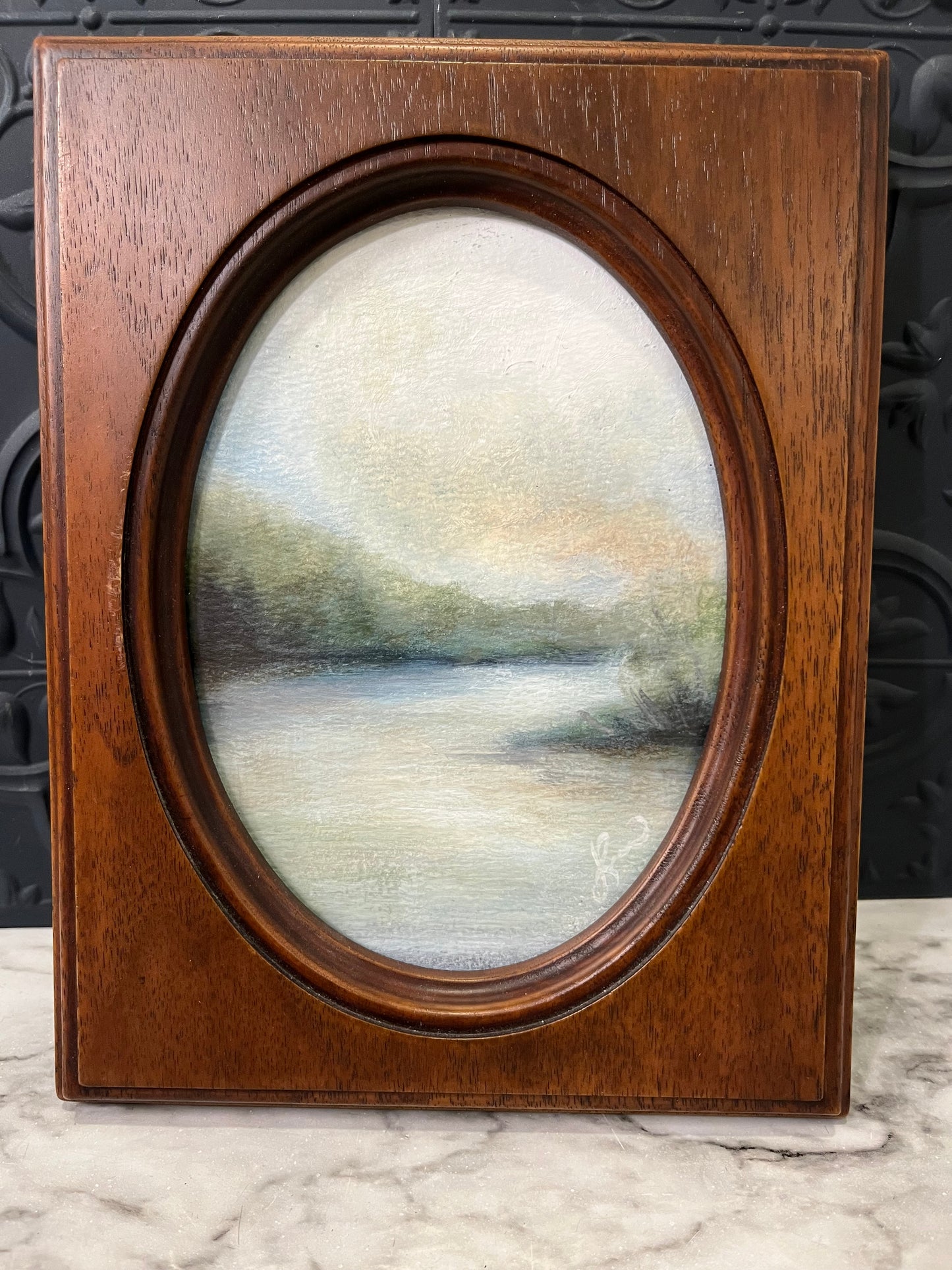 Lazy River painting in wood oval by Jessie