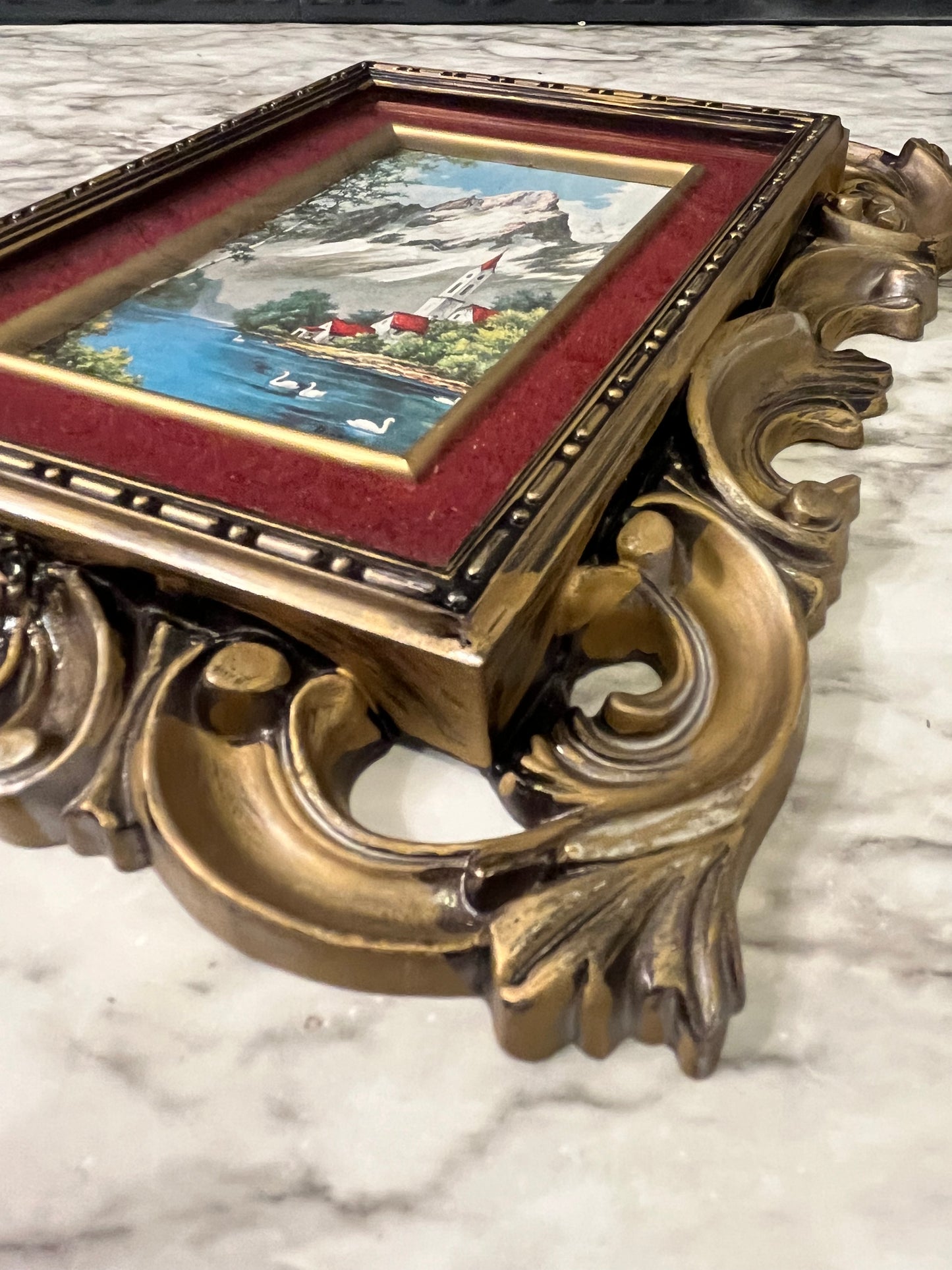 Ornate plastic frame with Church by lake print