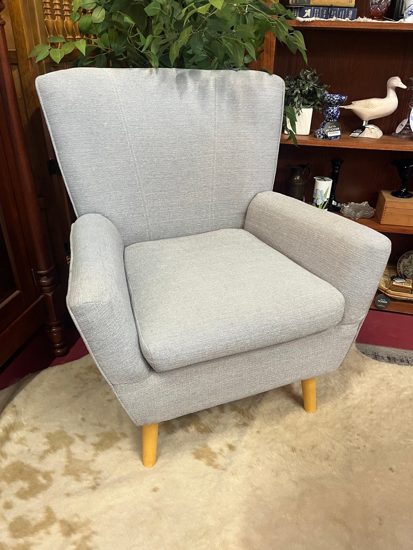 Gray arm chair with modern silhouette
