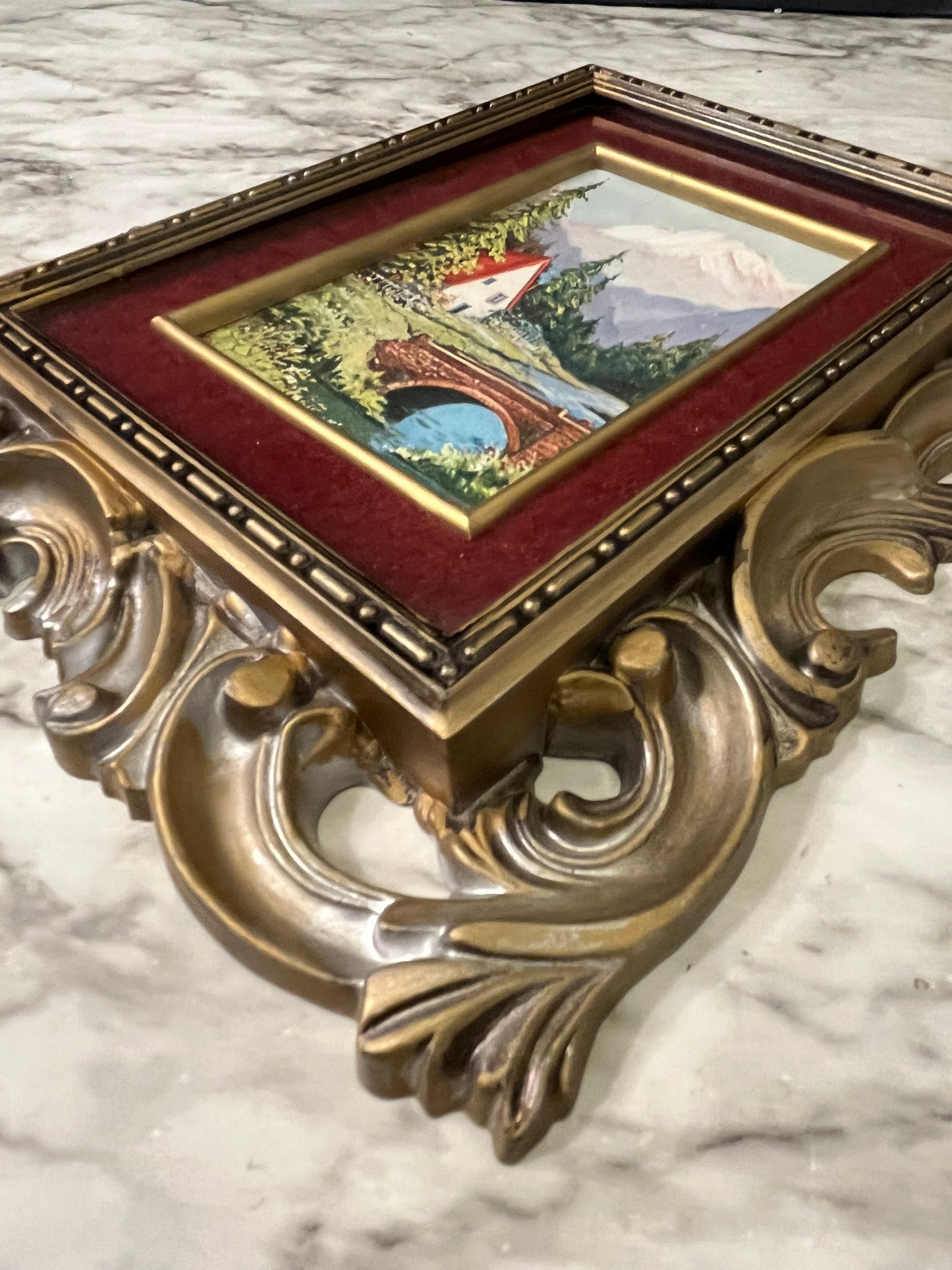 Ornate plastic frame with bridge print