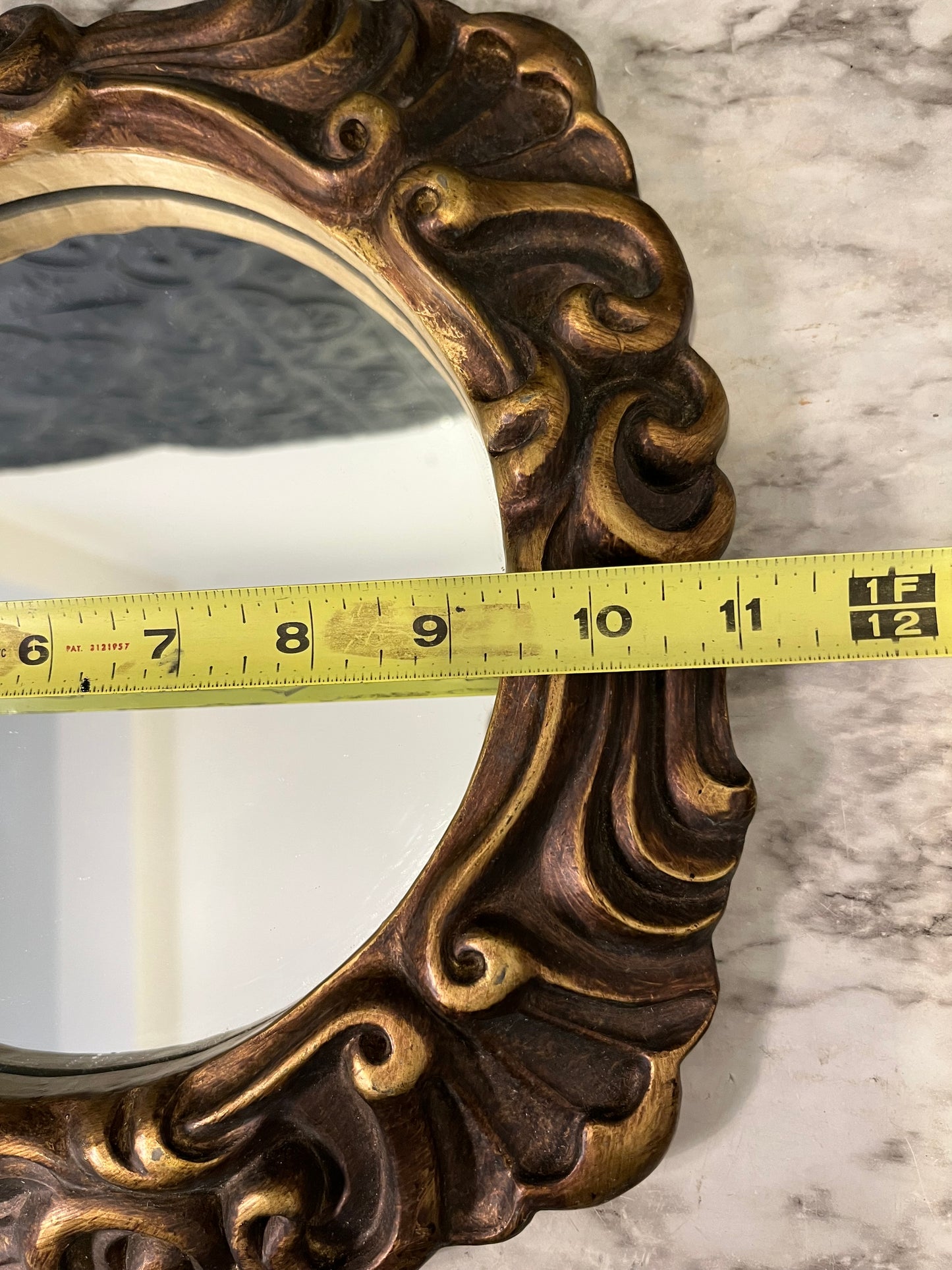 Ornate round mirror with resin frame 11"