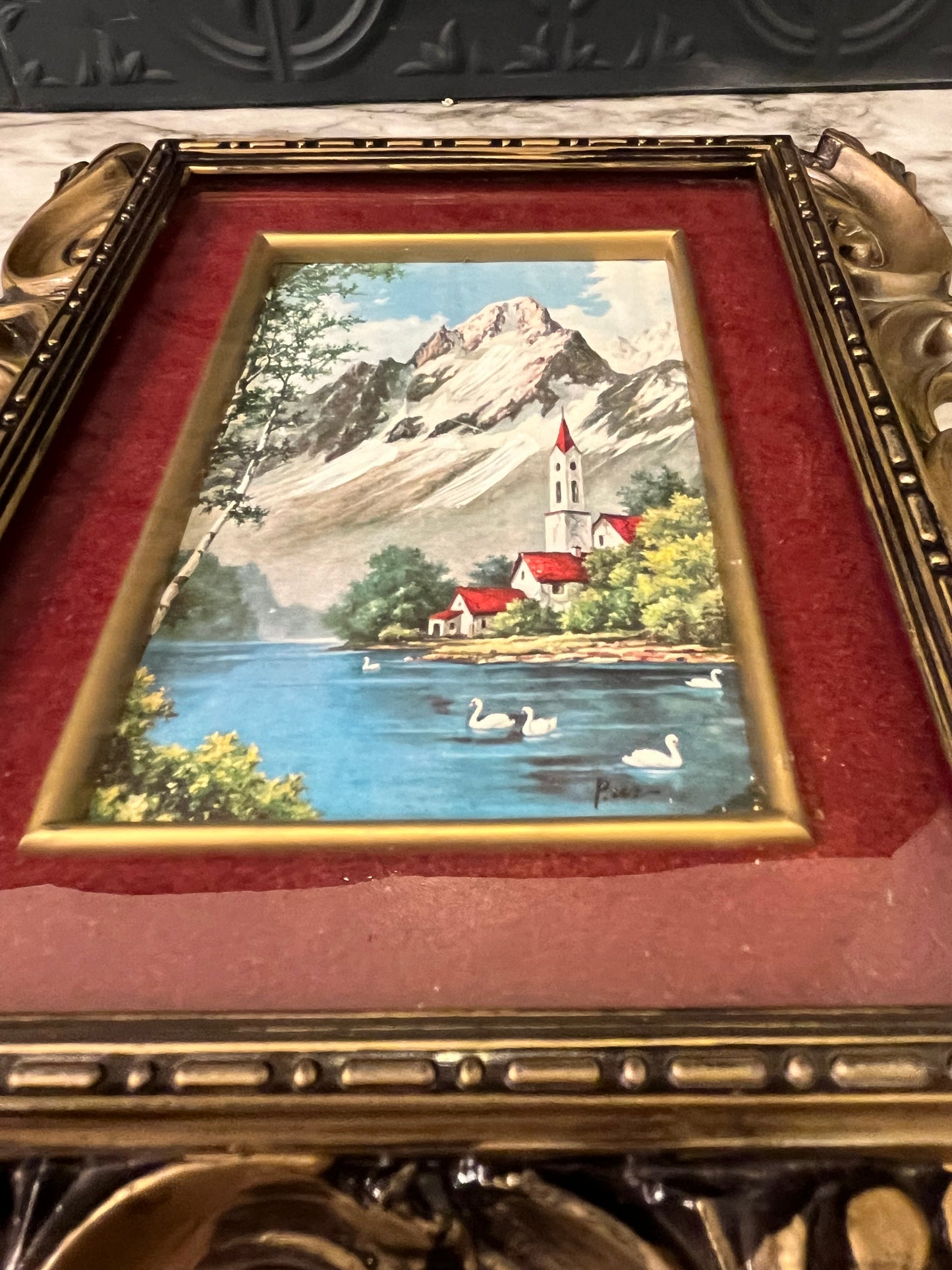 Ornate plastic frame with Church by lake print