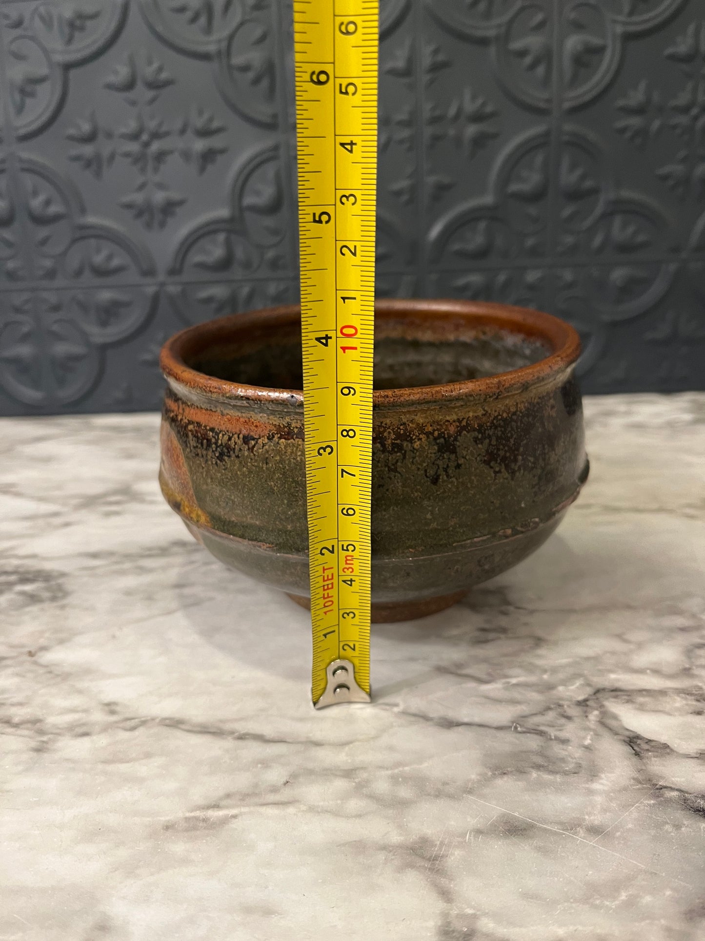 Brown Pottery Bowl with Leaf