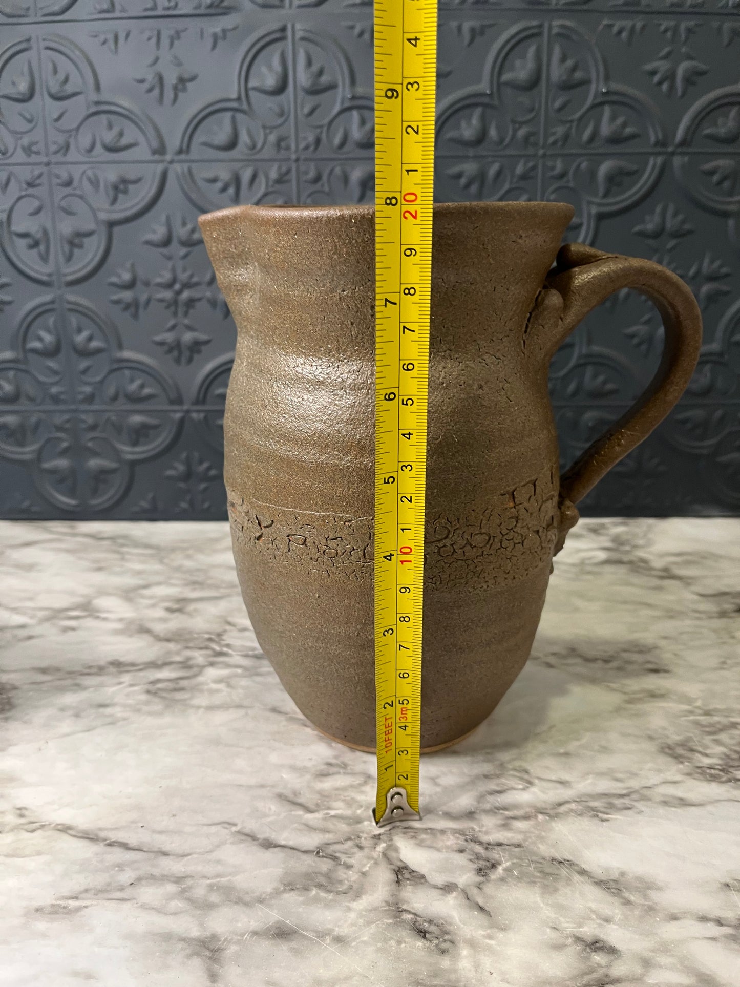 Brown Pottery Pitcher