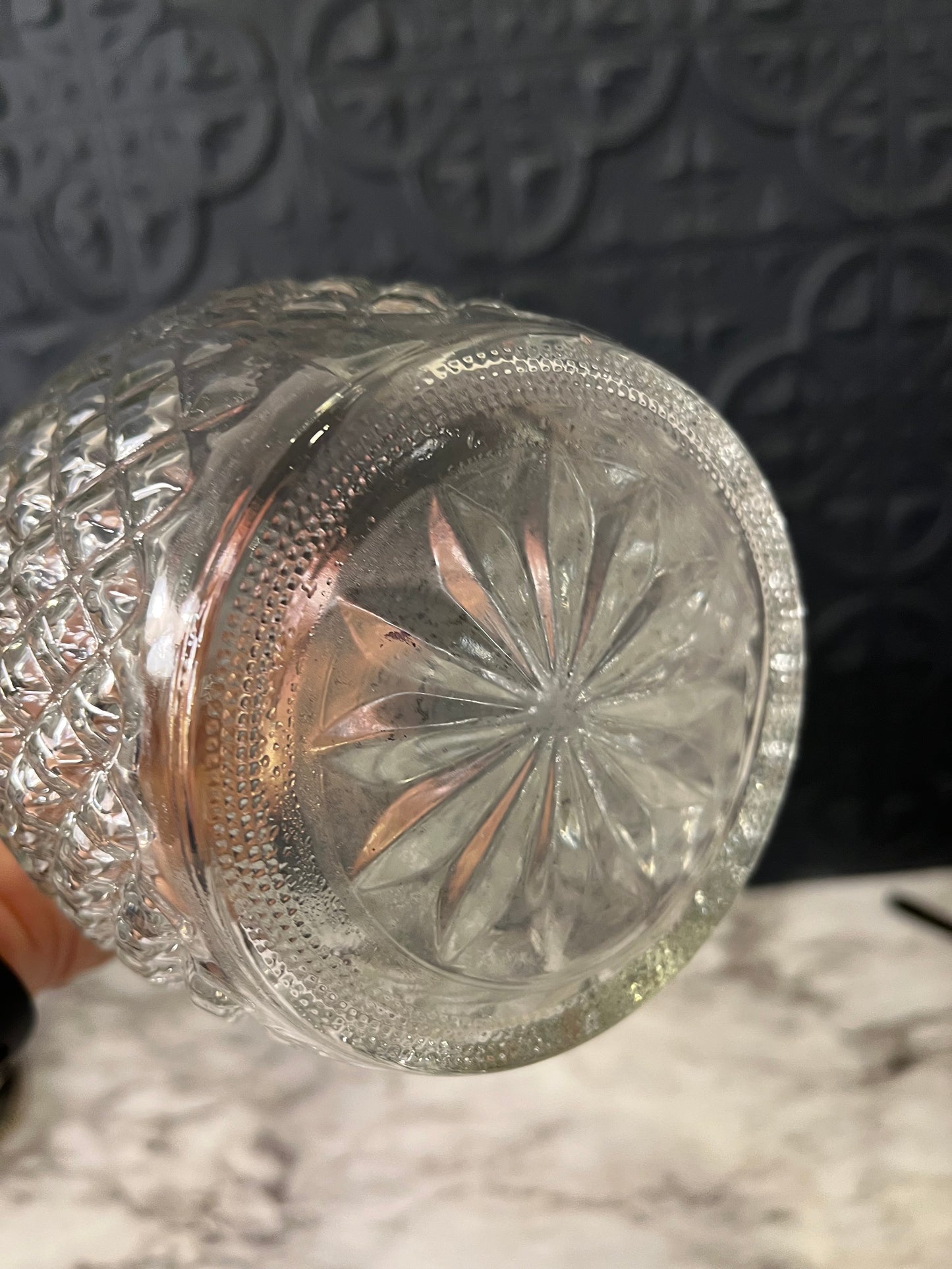 Clear glass decanter with grape and crown