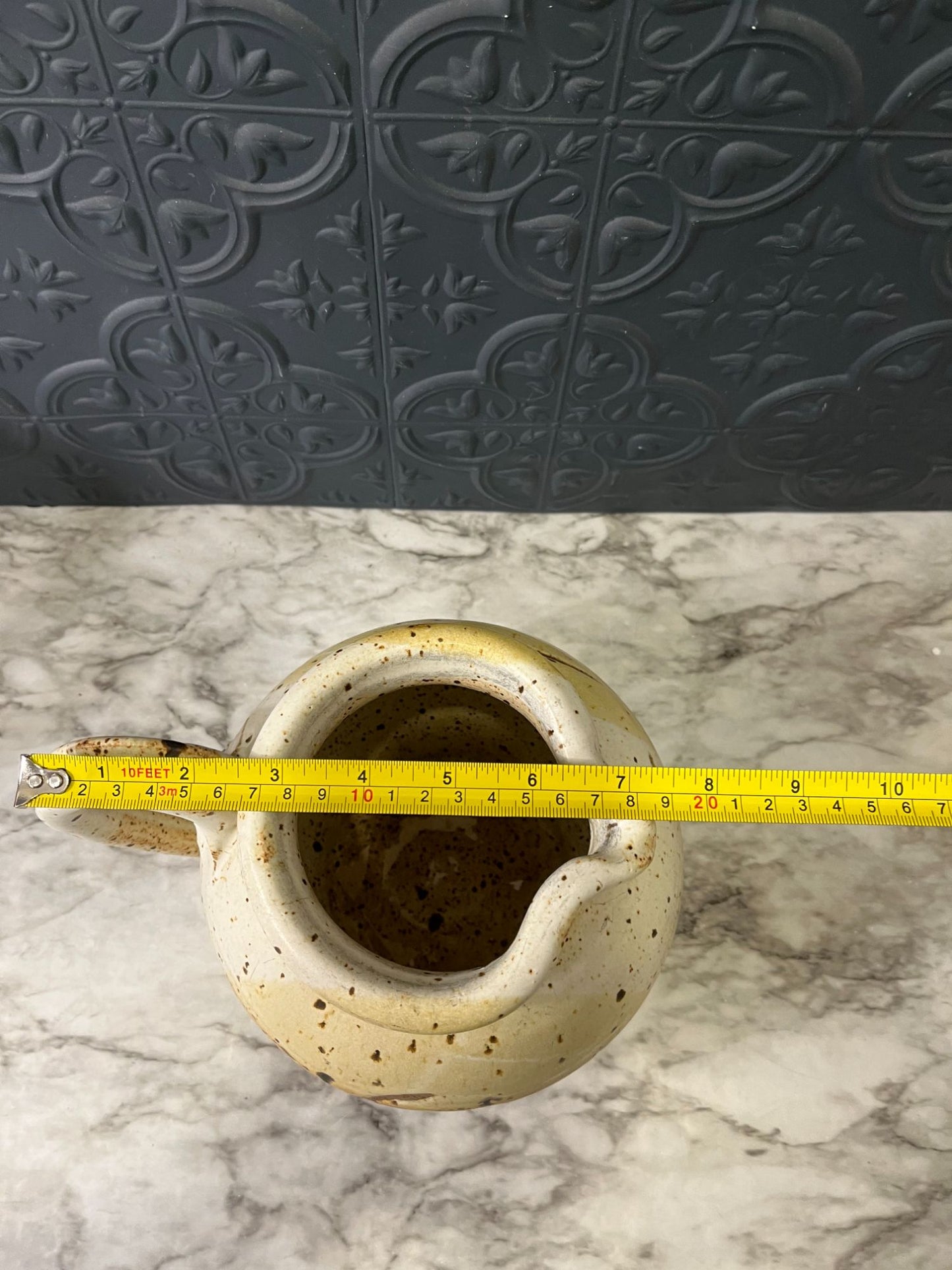 Round Pottery Pitcher With Spots