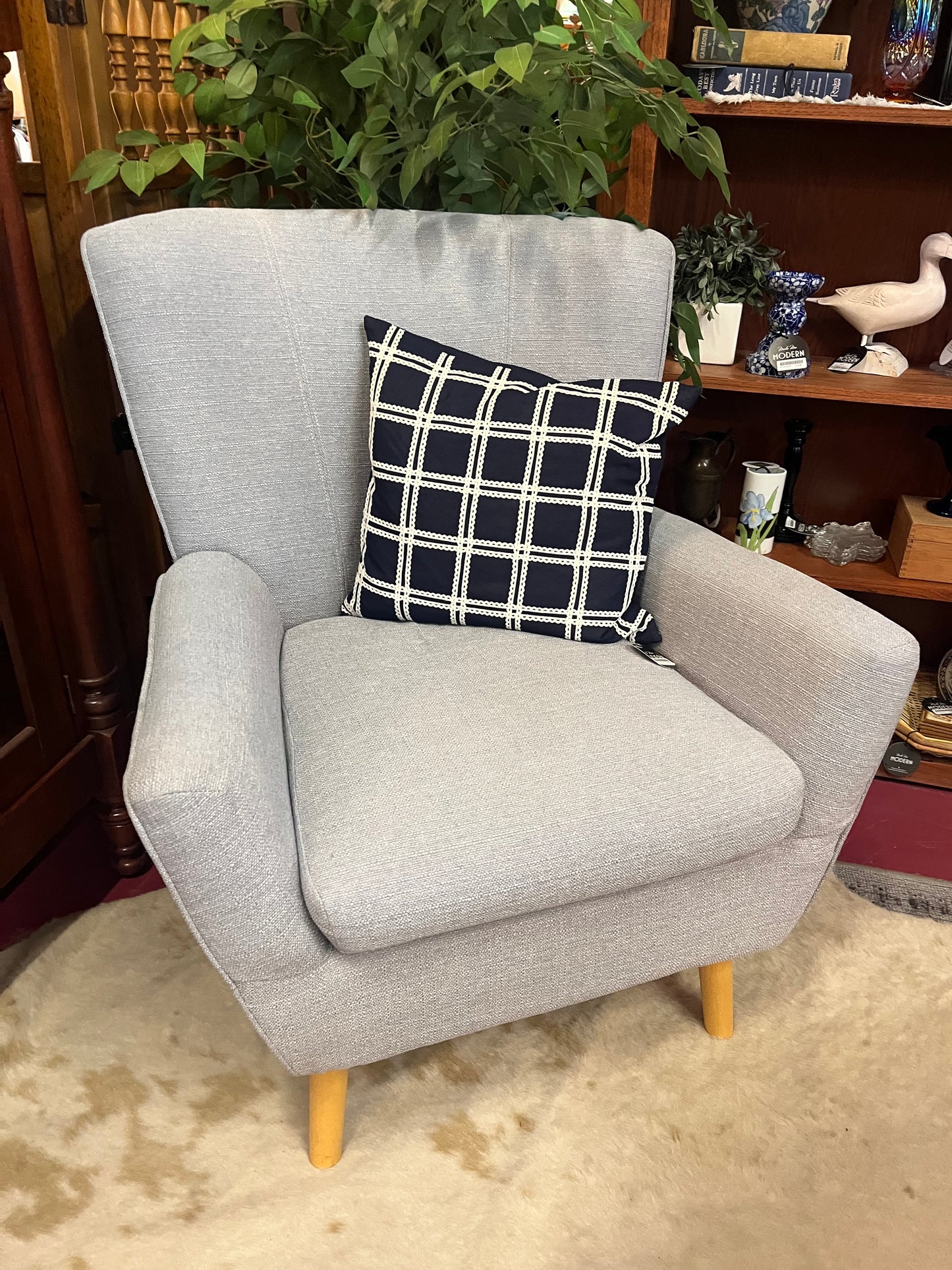 Gray arm chair with modern silhouette