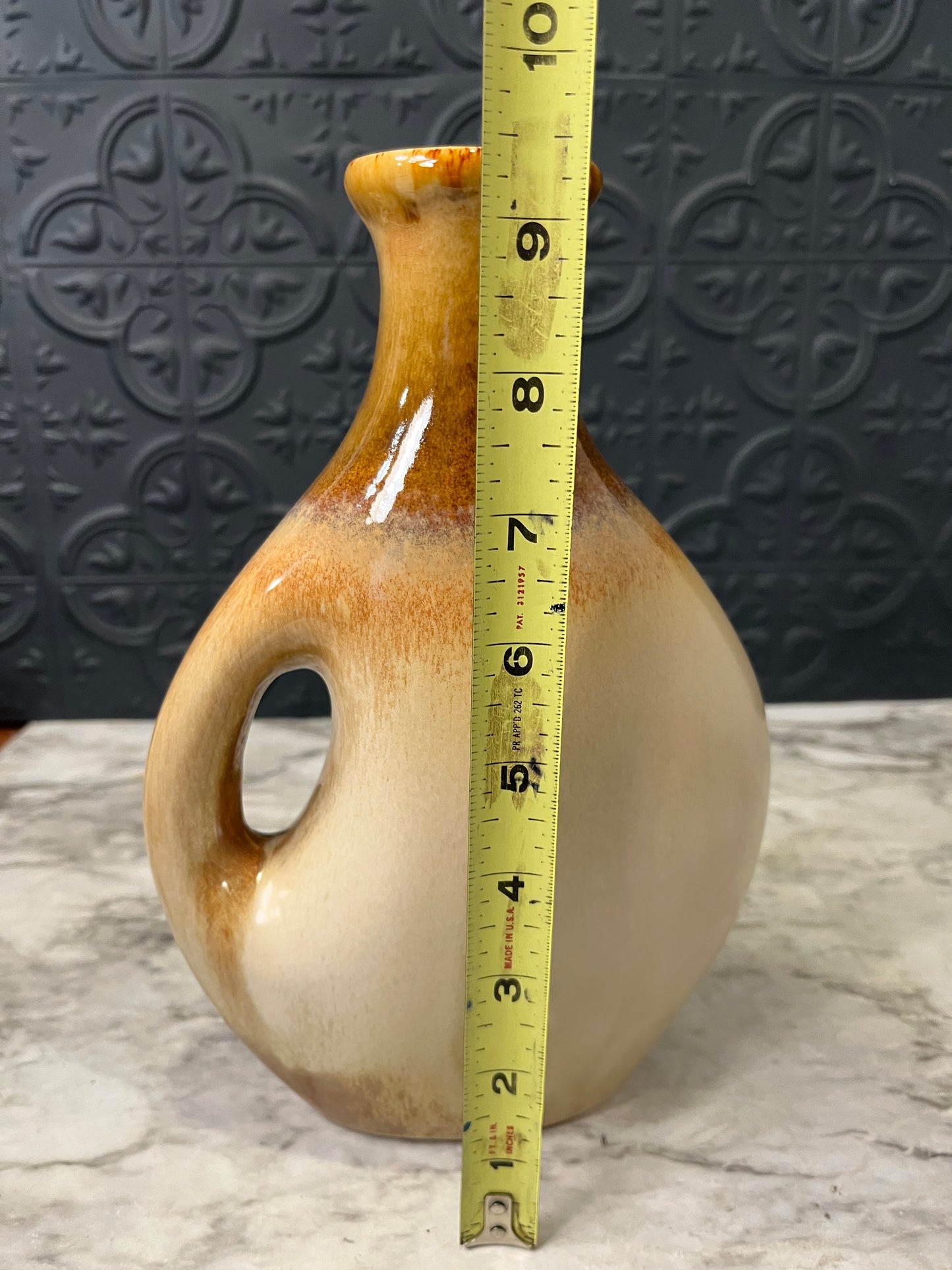 Tan Ceramic Vase with Brown Rim and Modern Handle design