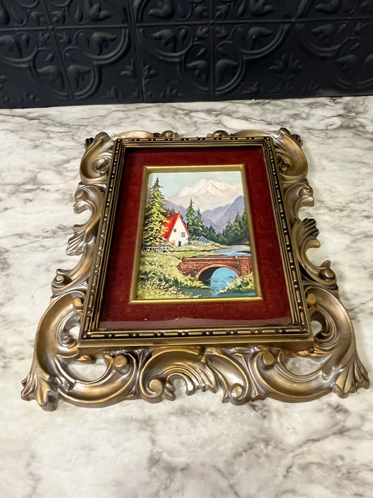 Ornate plastic frame with bridge print