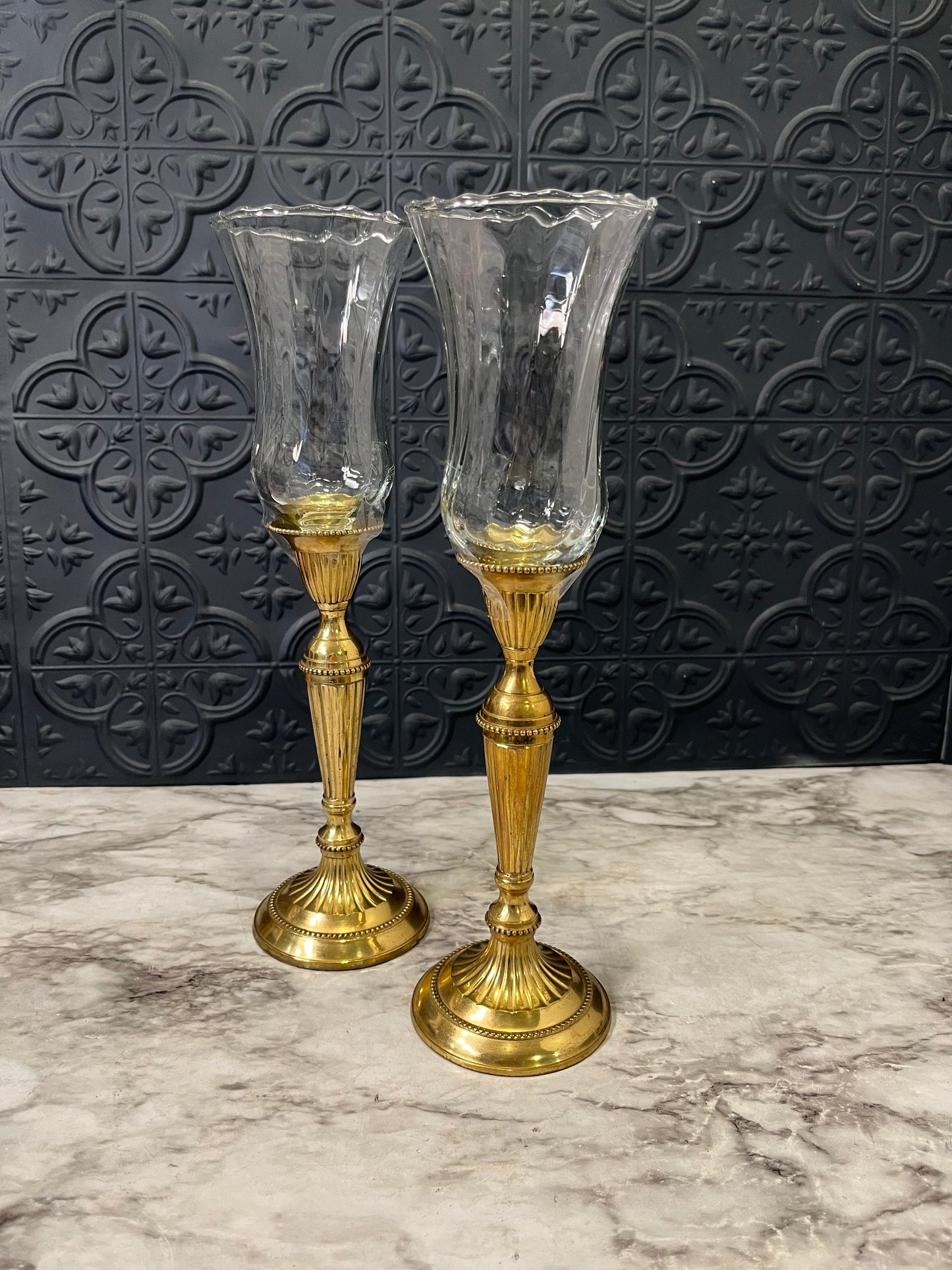 Brass candle holders with clear votive holders