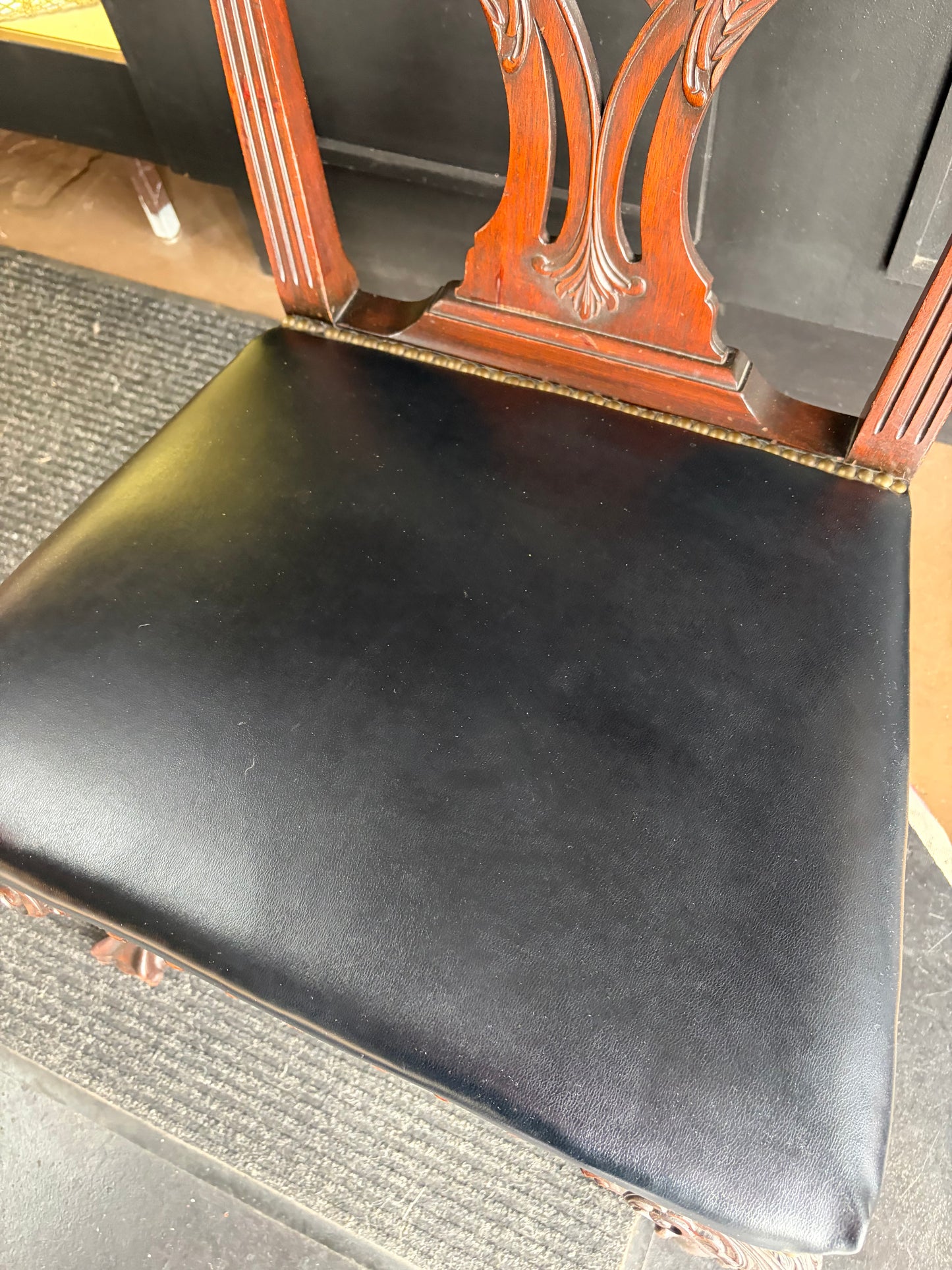 Antique Carved Chair with Black Seat