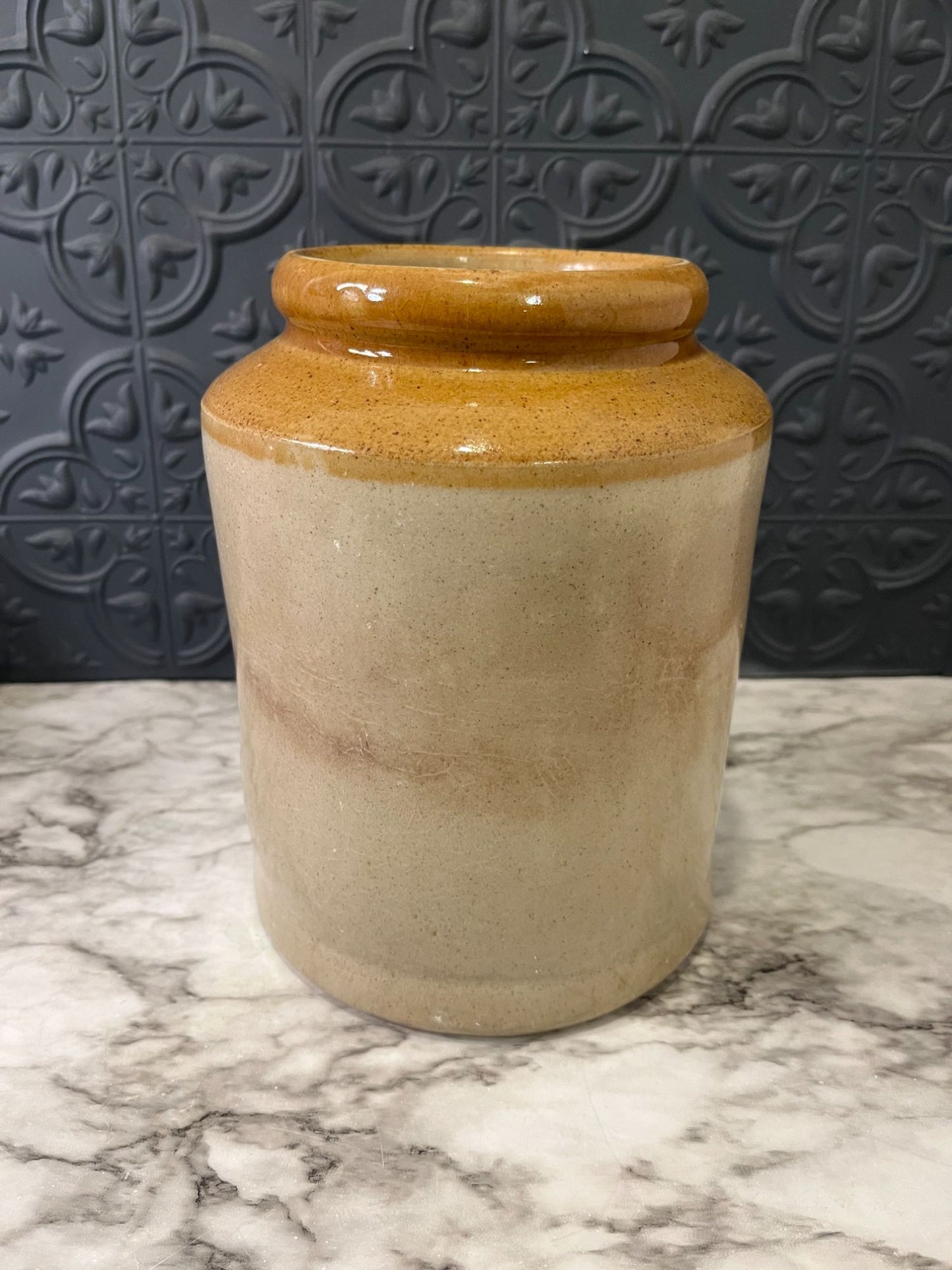 Pottery crock with brown top