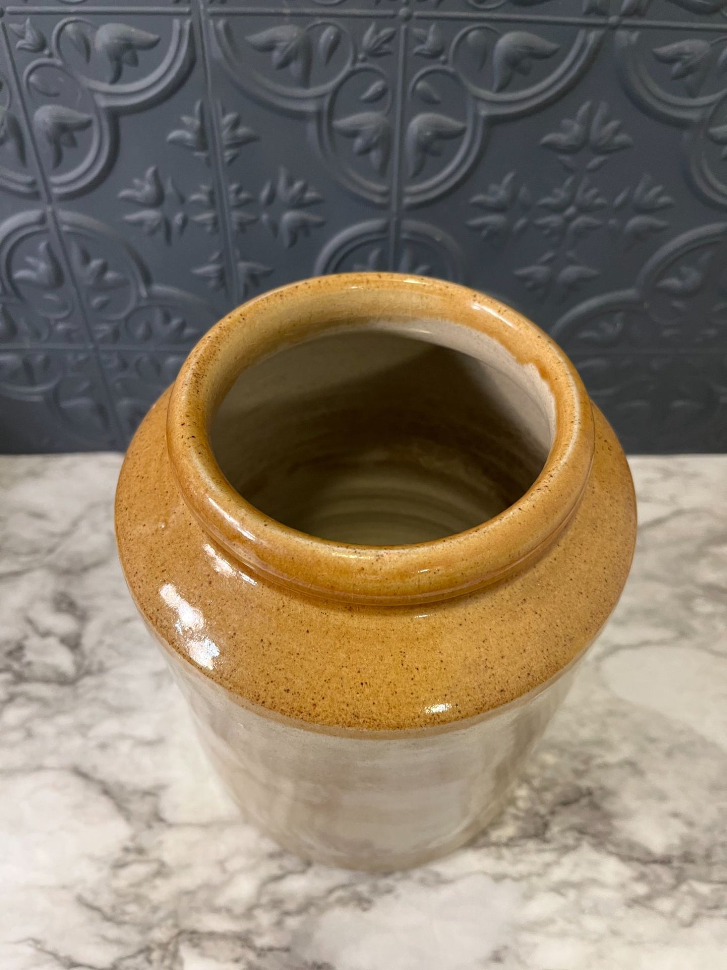 Pottery crock with brown top