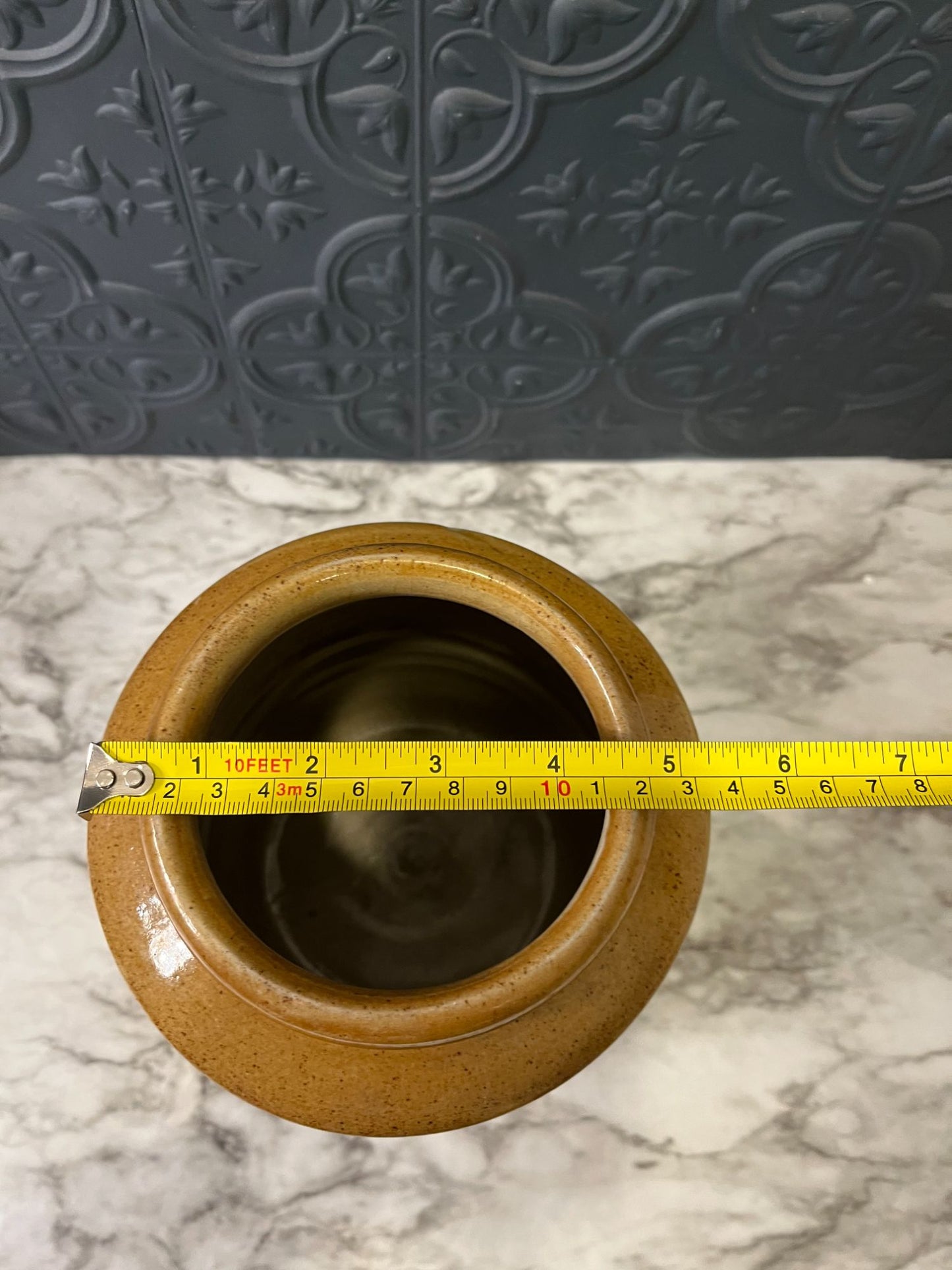 Pottery crock with brown top