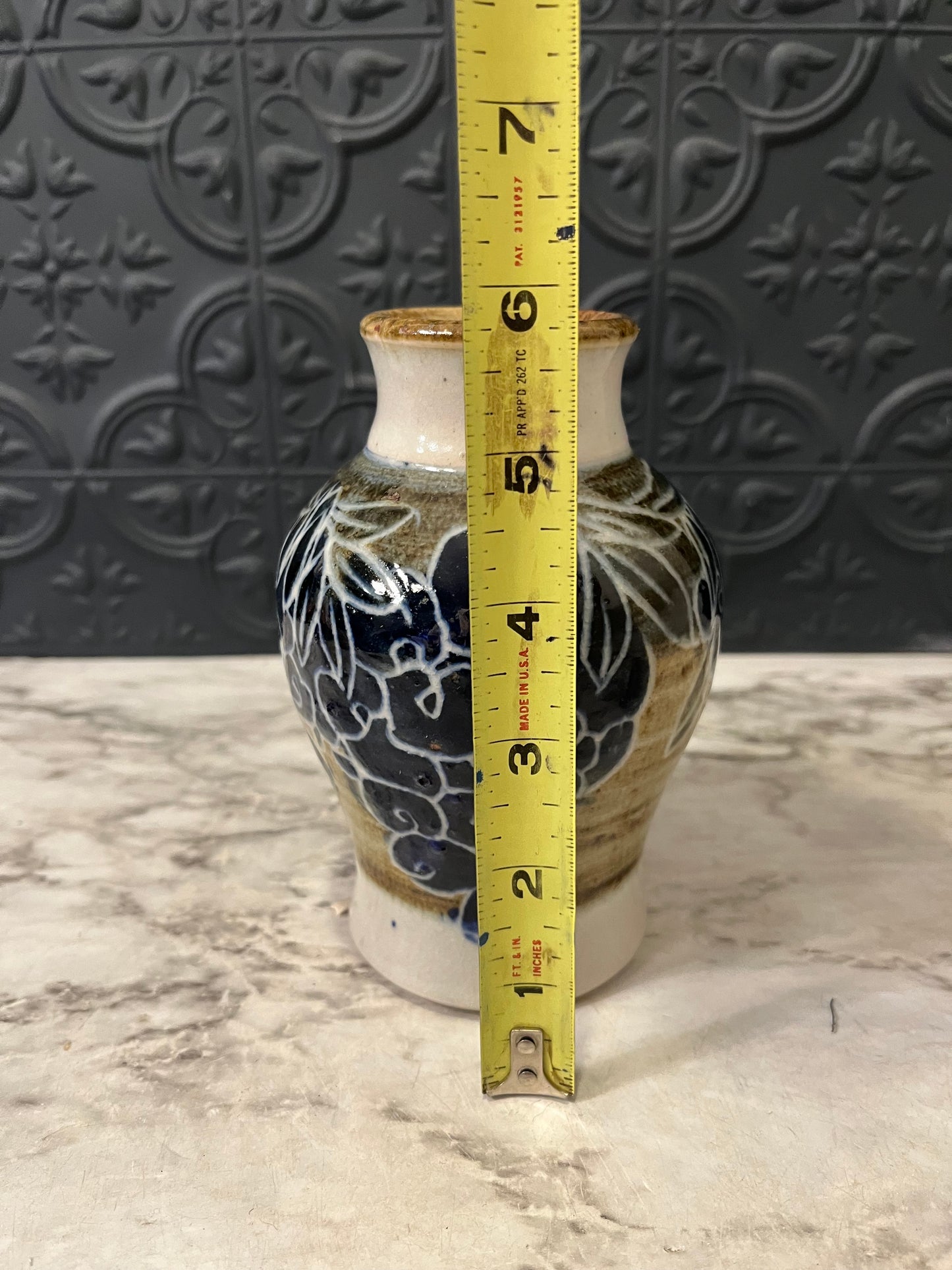 Pottery vase with Grape design