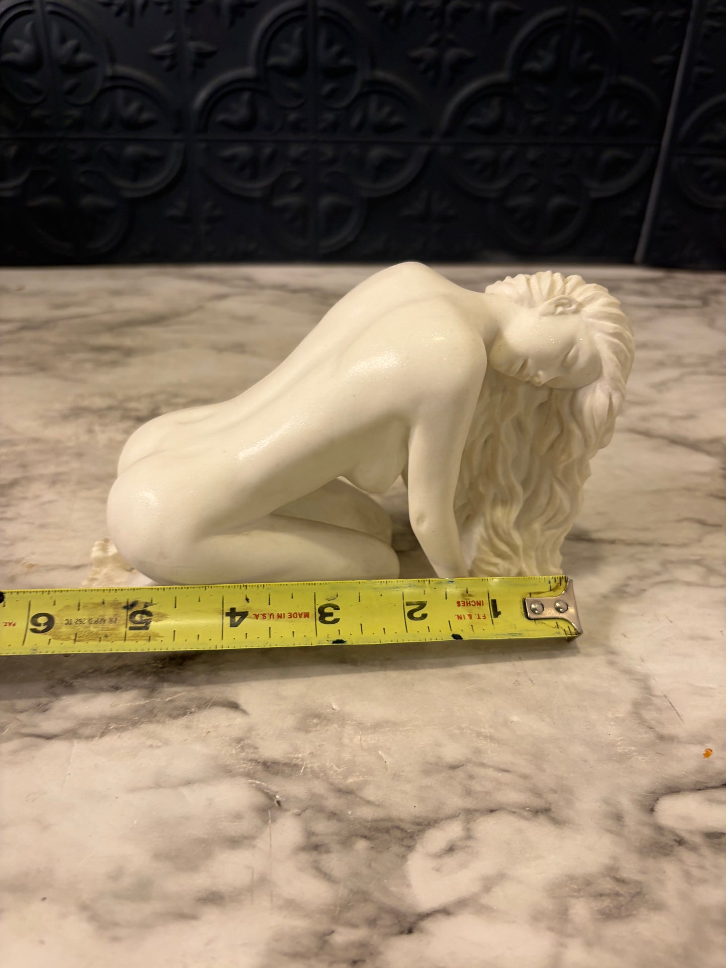 Nude Woman Bent over Statue
