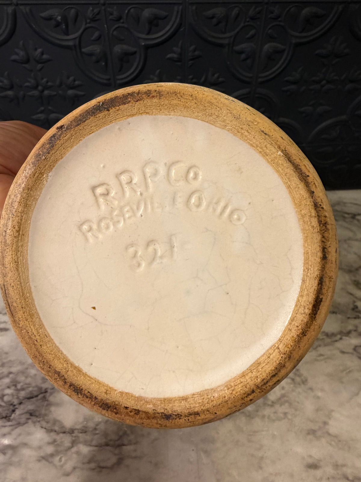 1920's Stoneware Pitcher with Relief RRP Co