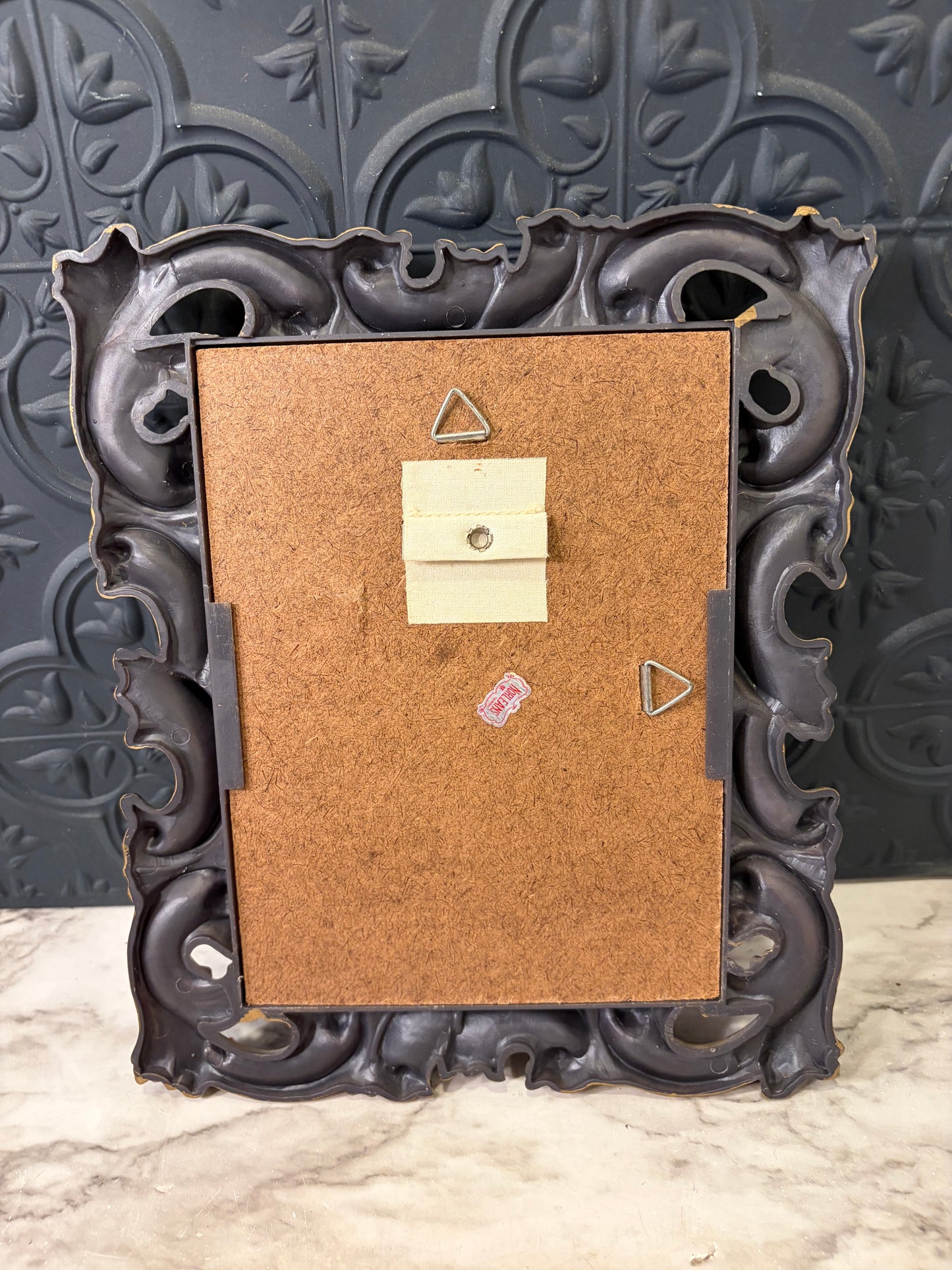 Black and Gold Molded Frame of Bridge