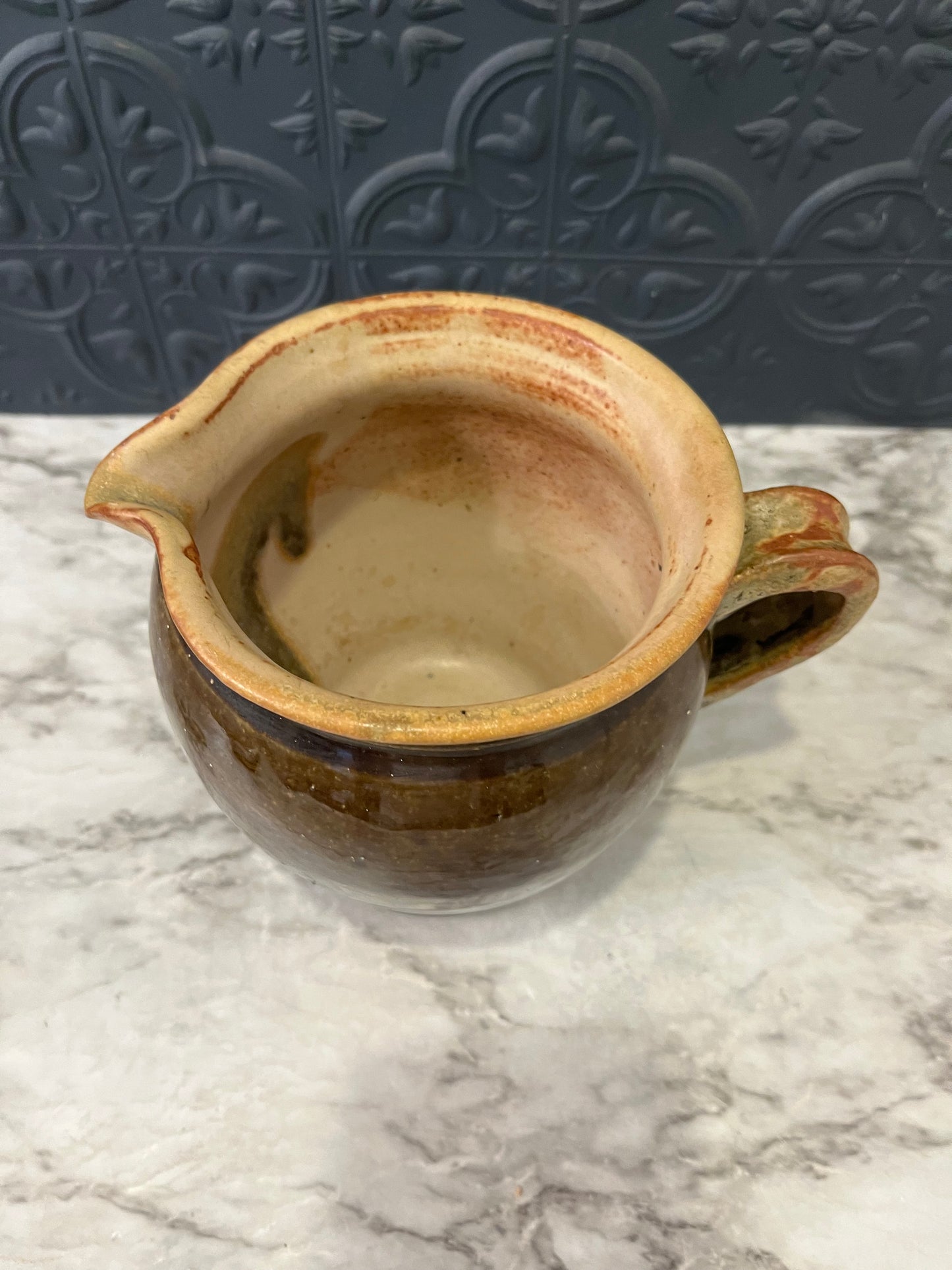 Brown Pottery Pitcher Light colored Rim