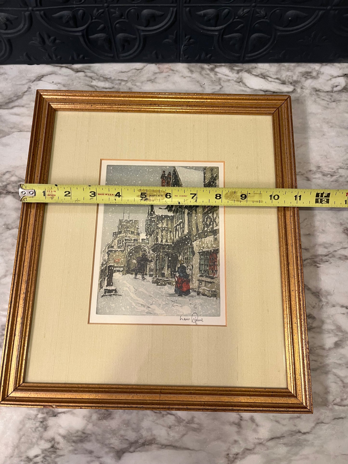 Snowy European street framed print