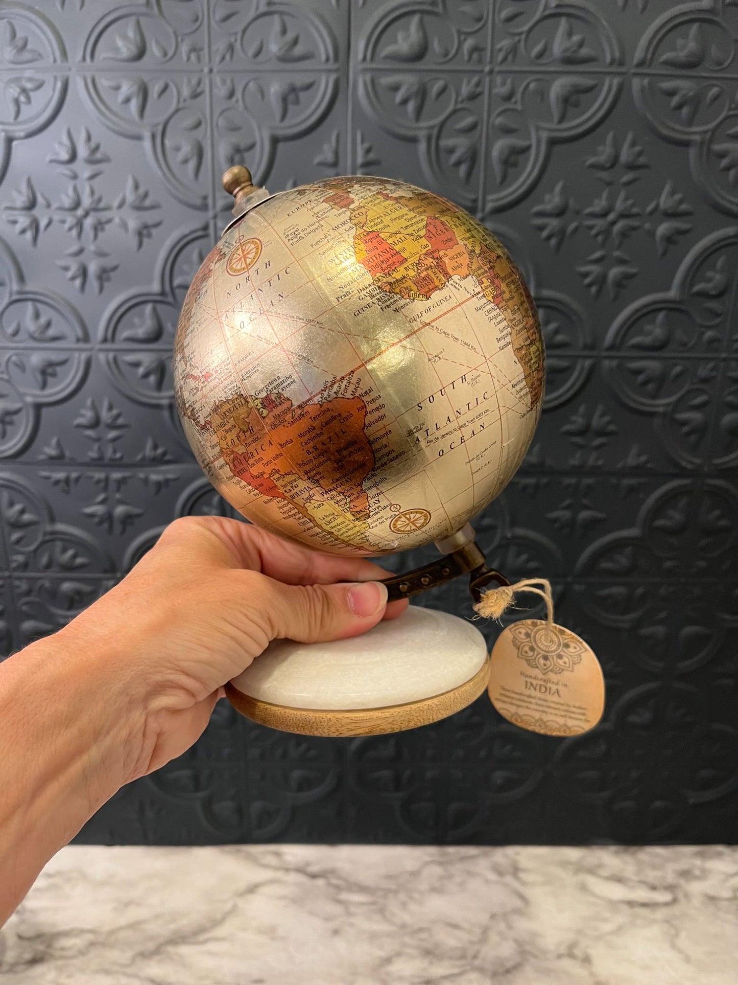 Small Metallic Globe on white  base