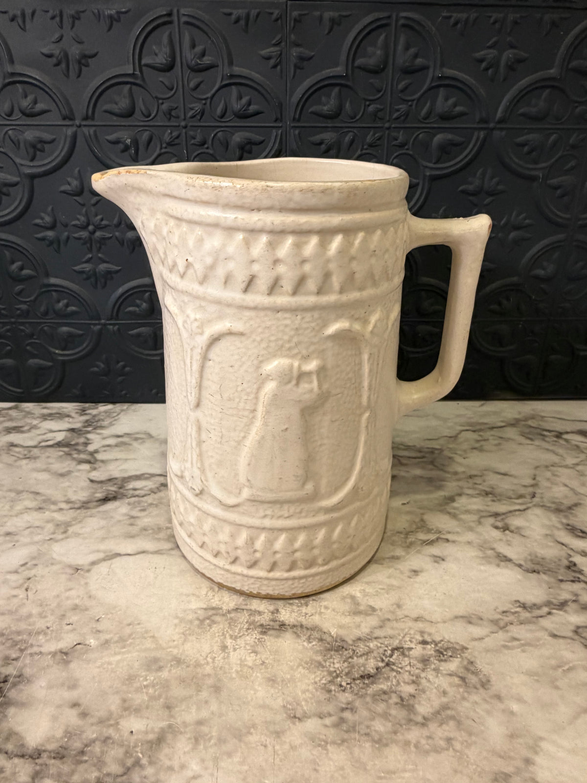 1920's Stoneware Pitcher with Relief RRP Co