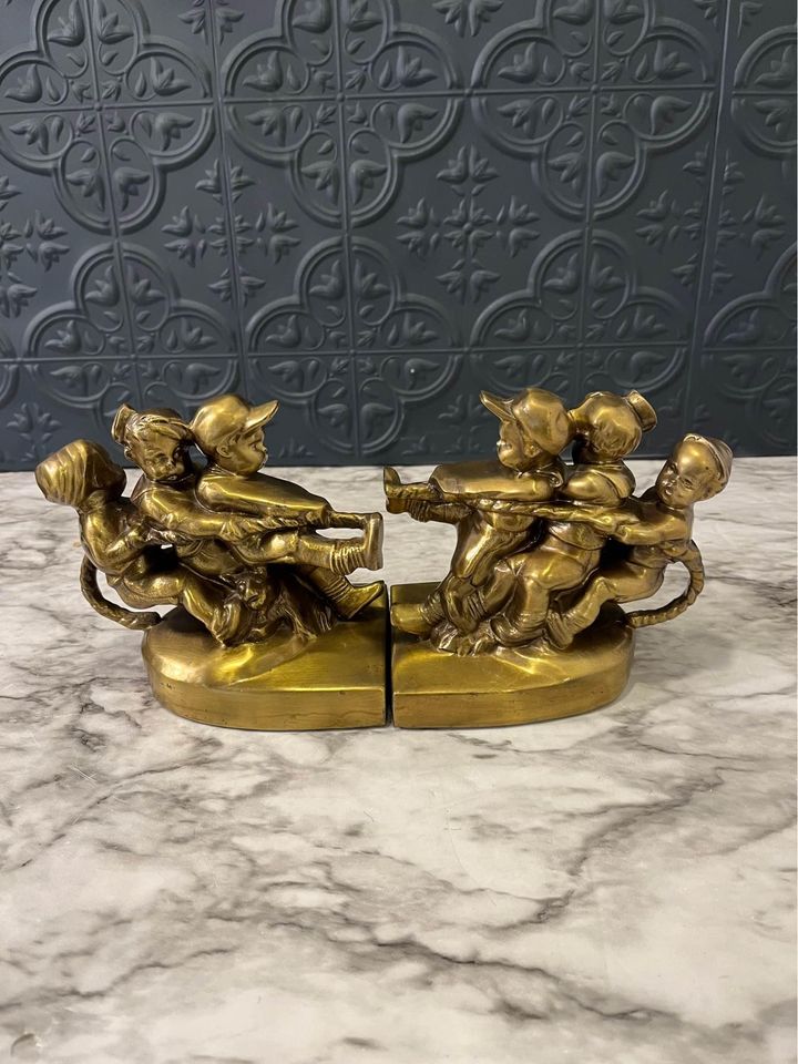 Tug of war brass bookends