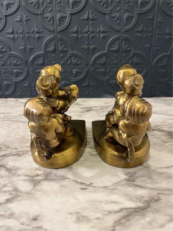 Tug of war brass bookends