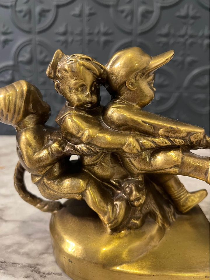 Tug of war brass bookends