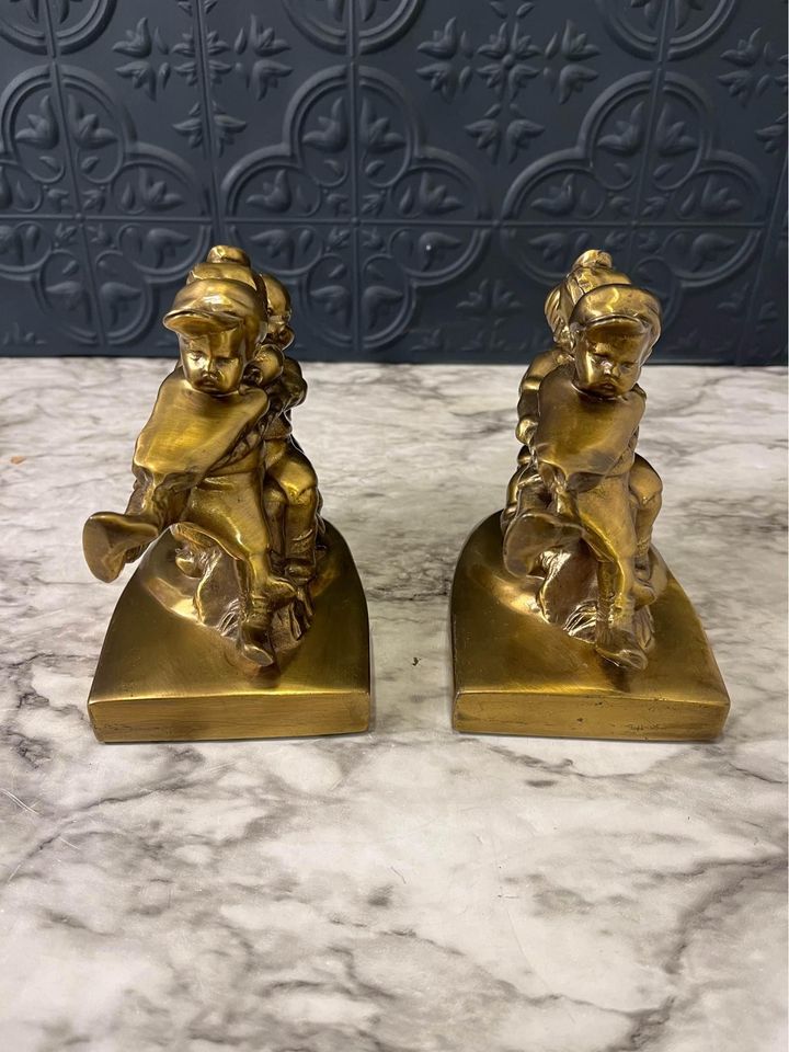 Tug of war brass bookends