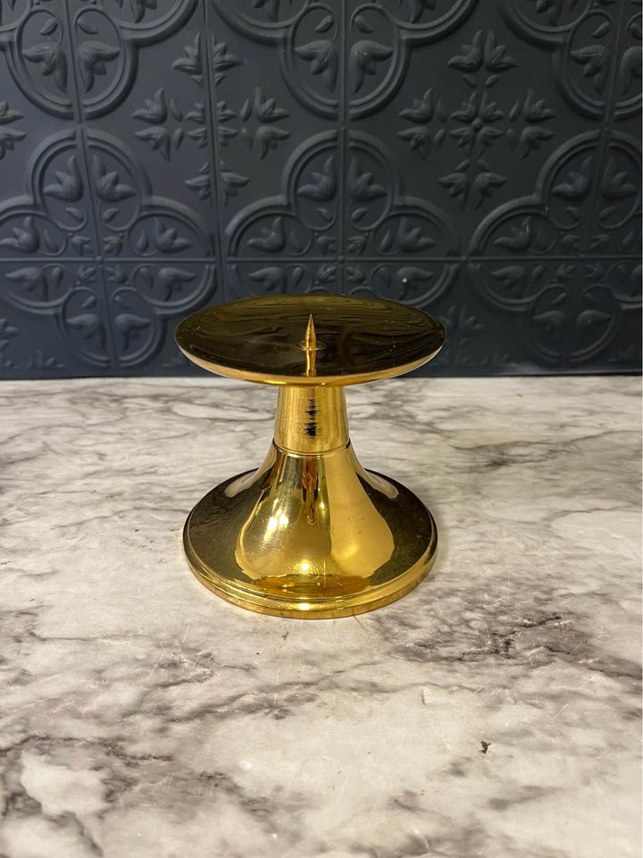 shiny brass pedestal candle holder with spike