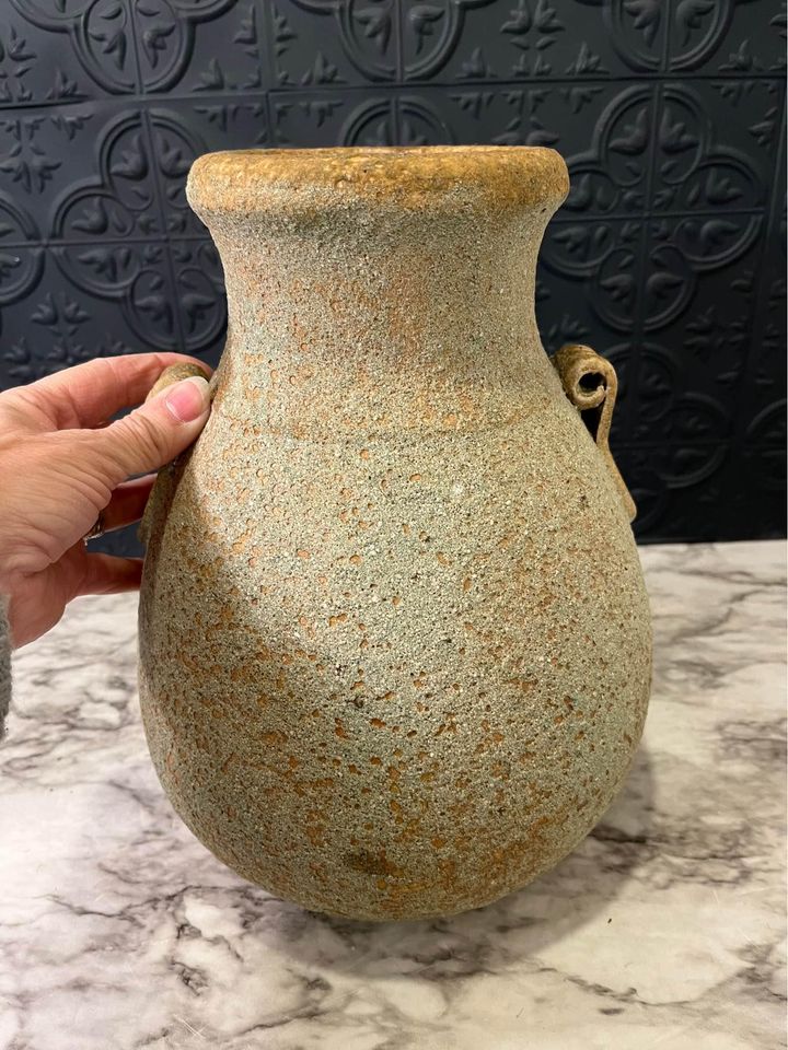 Rough tan pottery jug