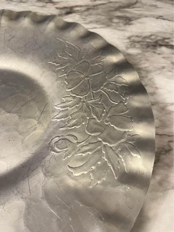 Pewter plate with flowers