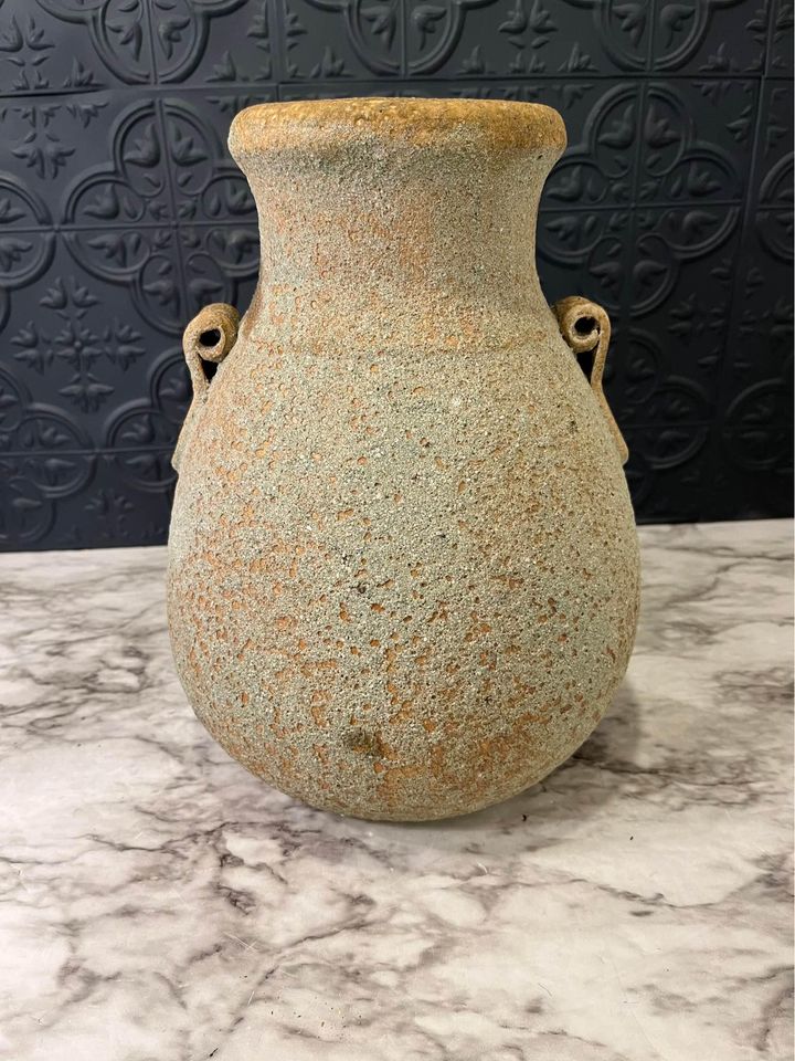 Rough tan pottery jug