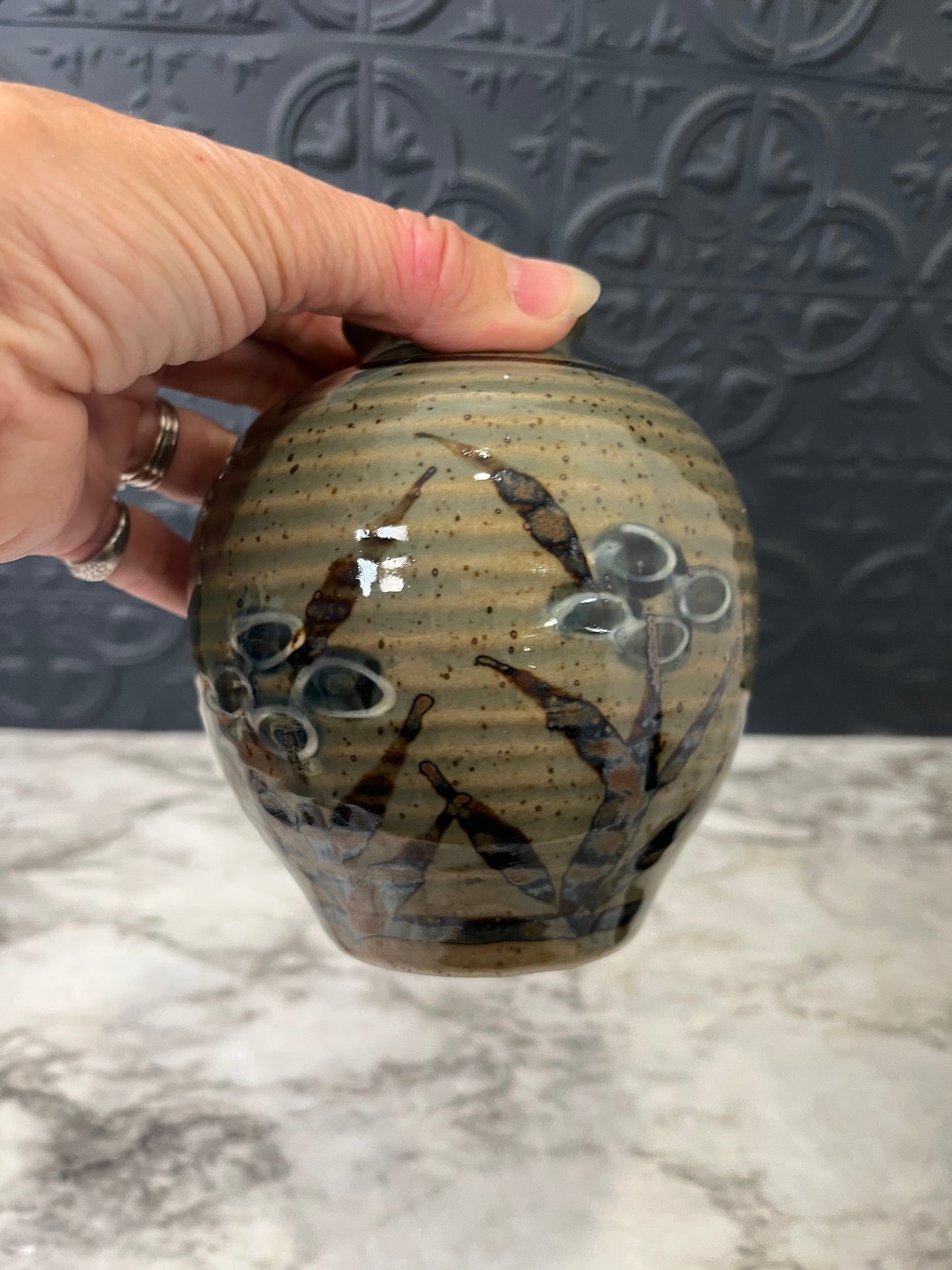 Small Ribbed Pottery Vase with Flowers