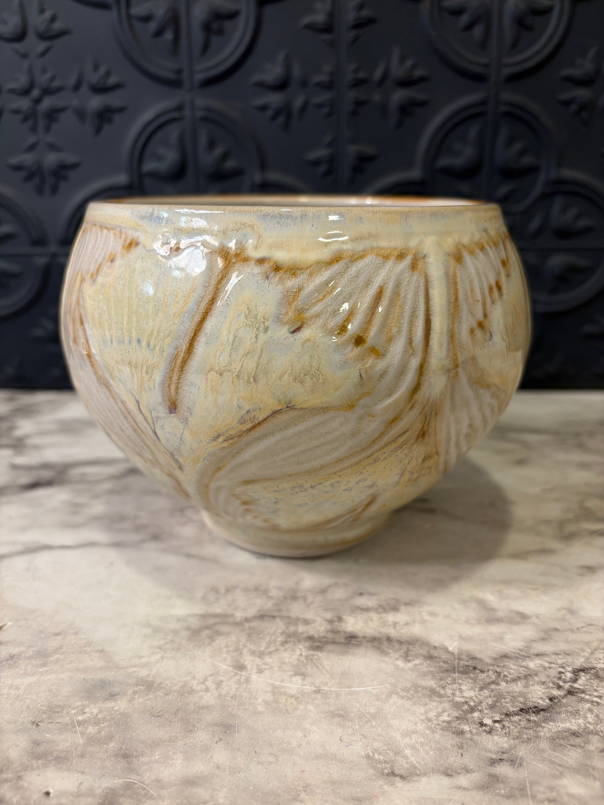 Cream Pottery Bowl With OrangE Swirl Design