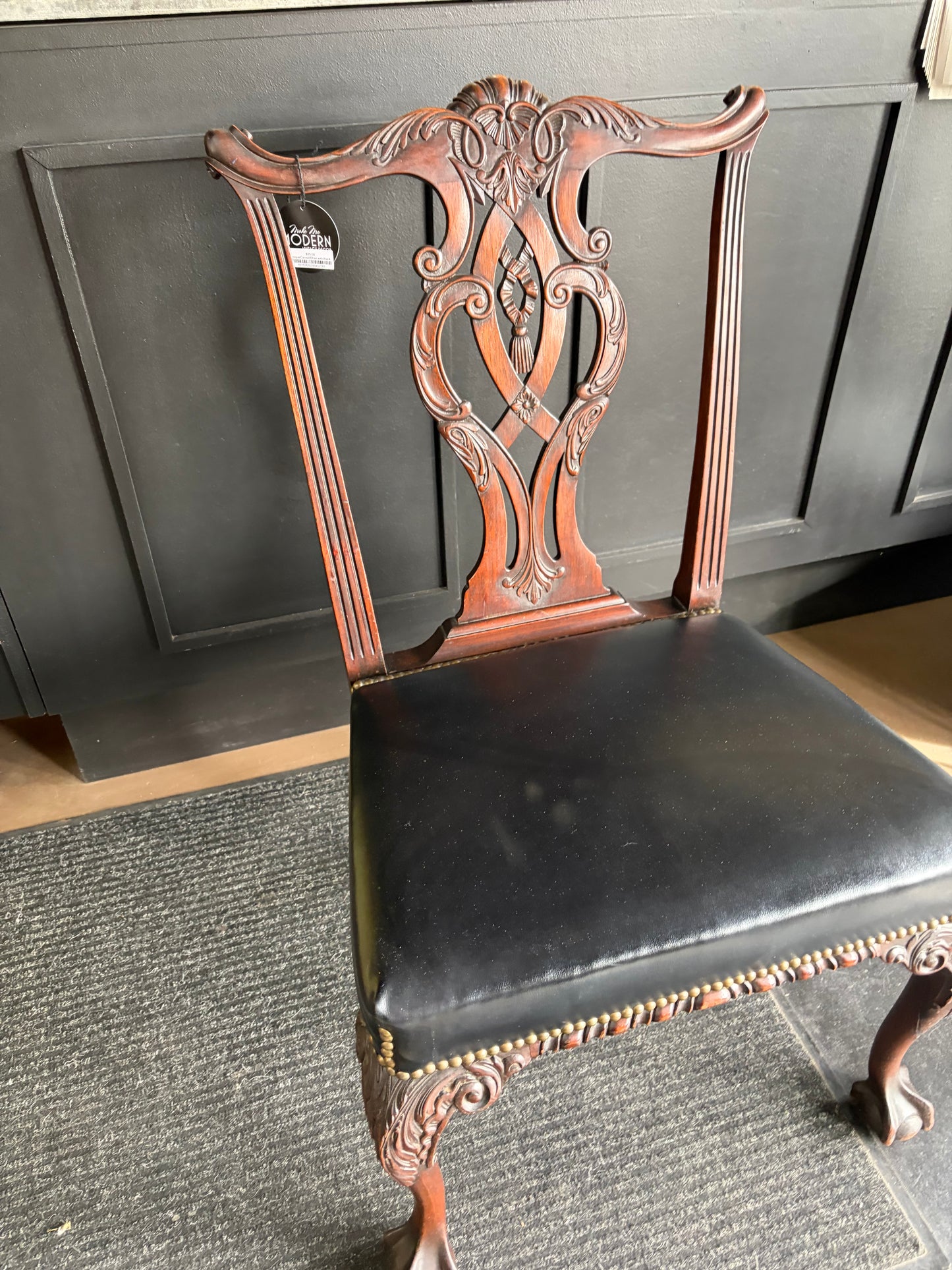 Antique Carved Chair with Black Seat