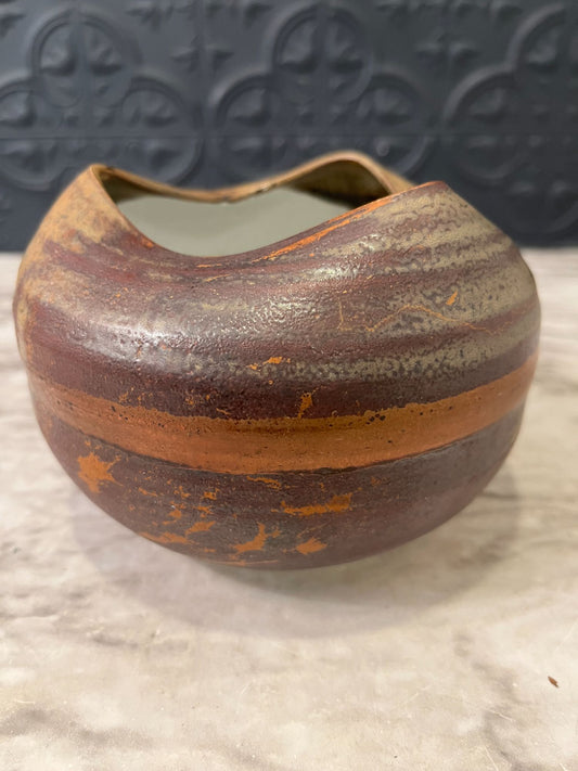 Brown pottery bowl with folded  top