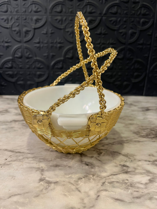 Milk glass bowl in gold wire basket